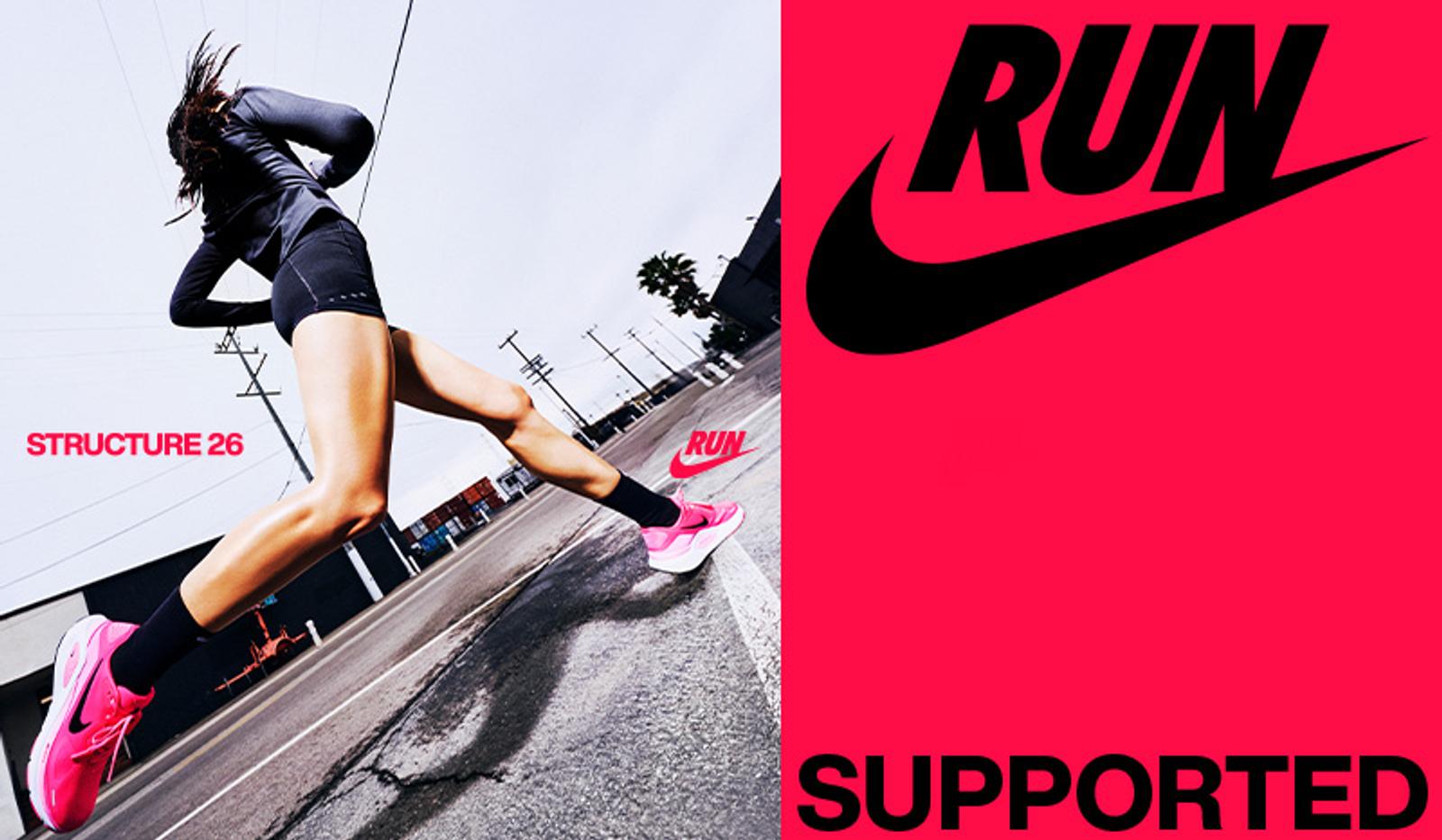 a woman is running down a street in a nike ad .