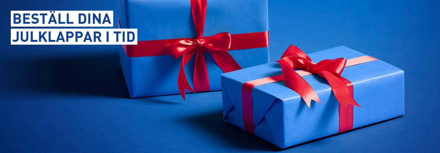 Two blue gift boxes with red ribbons and text: "Order your Christmas gifts in time."