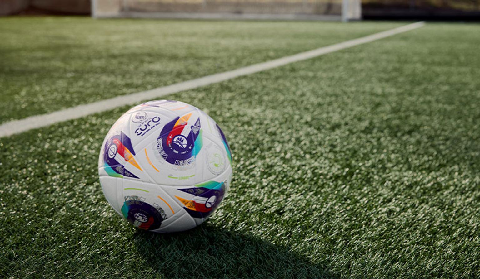 a soccer ball is sitting on top of a soccer field .