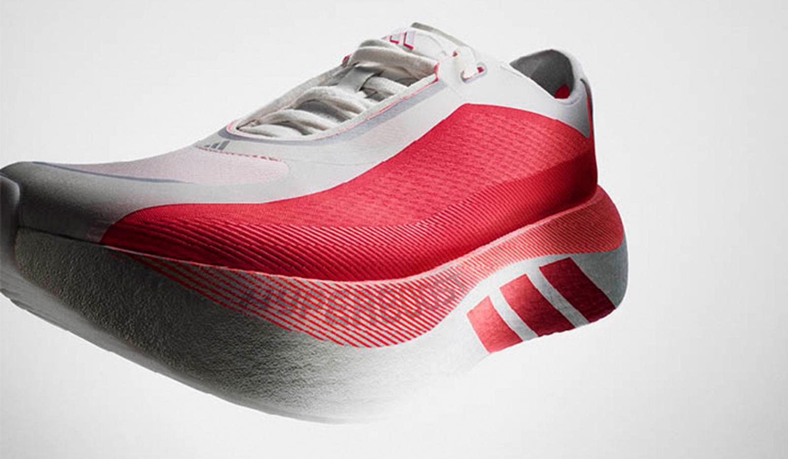 A white Adidas running shoe with a textured red midfoot panel, three red stripes on the heel, and a thick white sole.