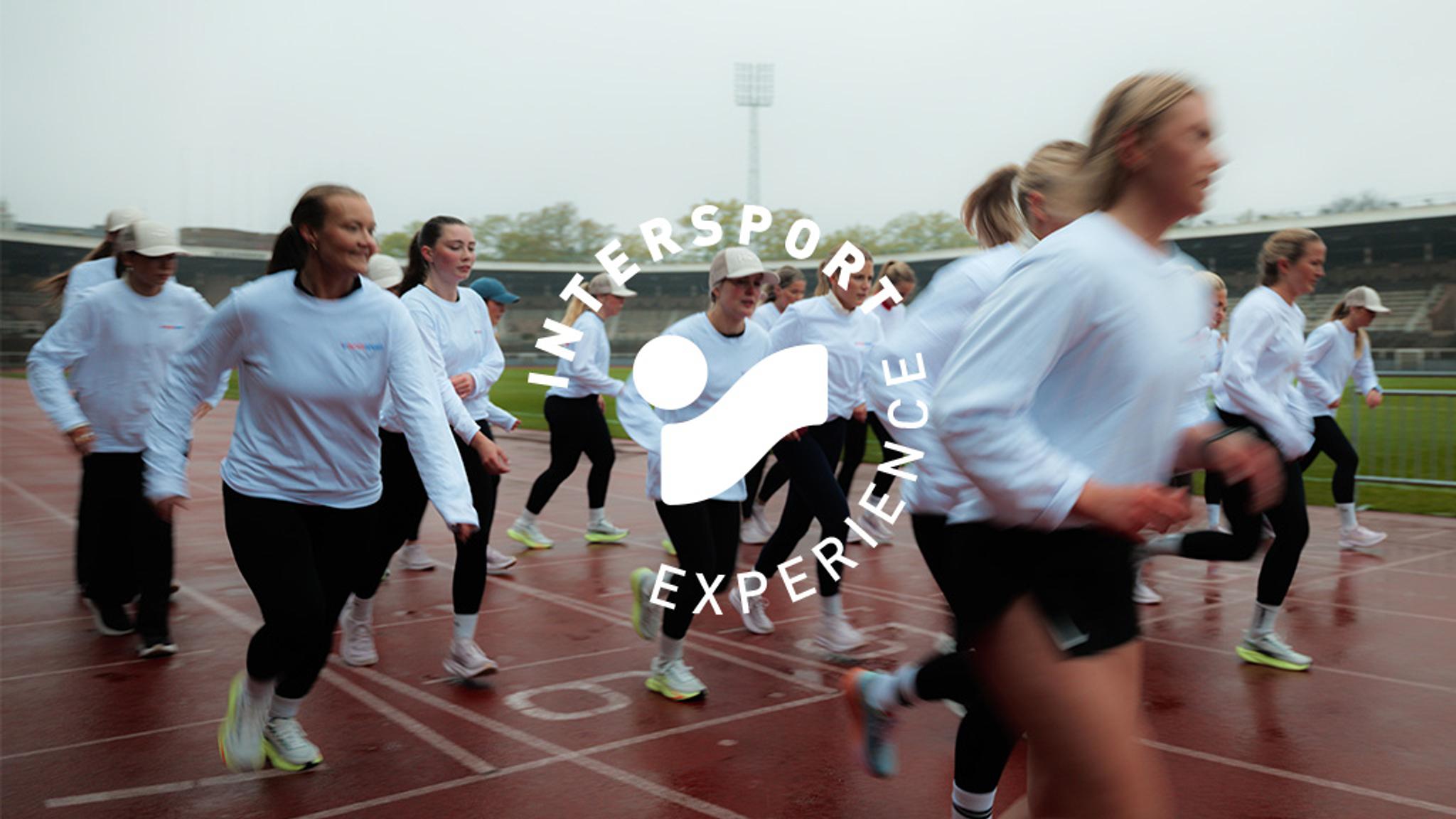 A group of women running on a wet red track with "INTERSPORT EXPERIENCE" overlaid.