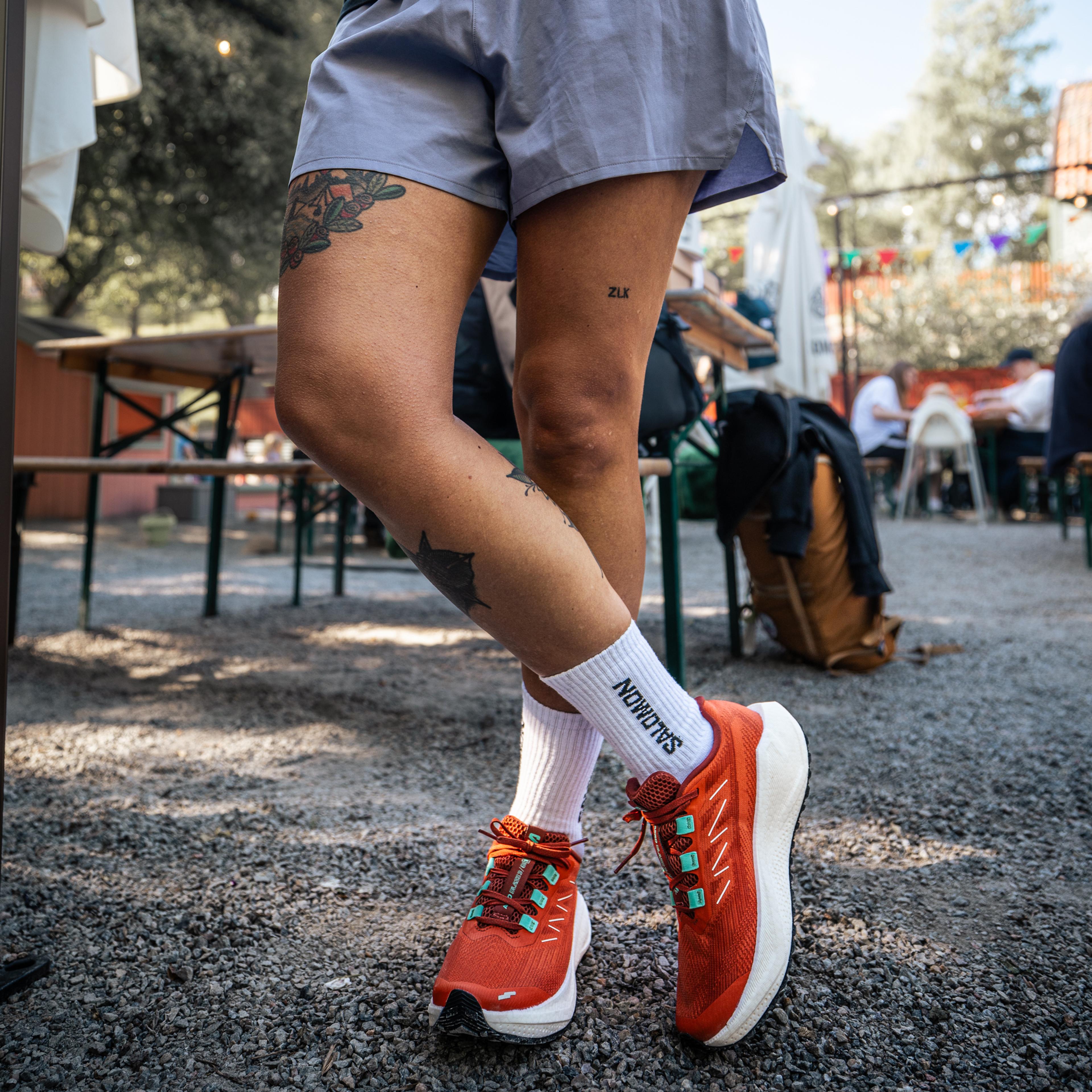 a person wearing a pair of salomon socks