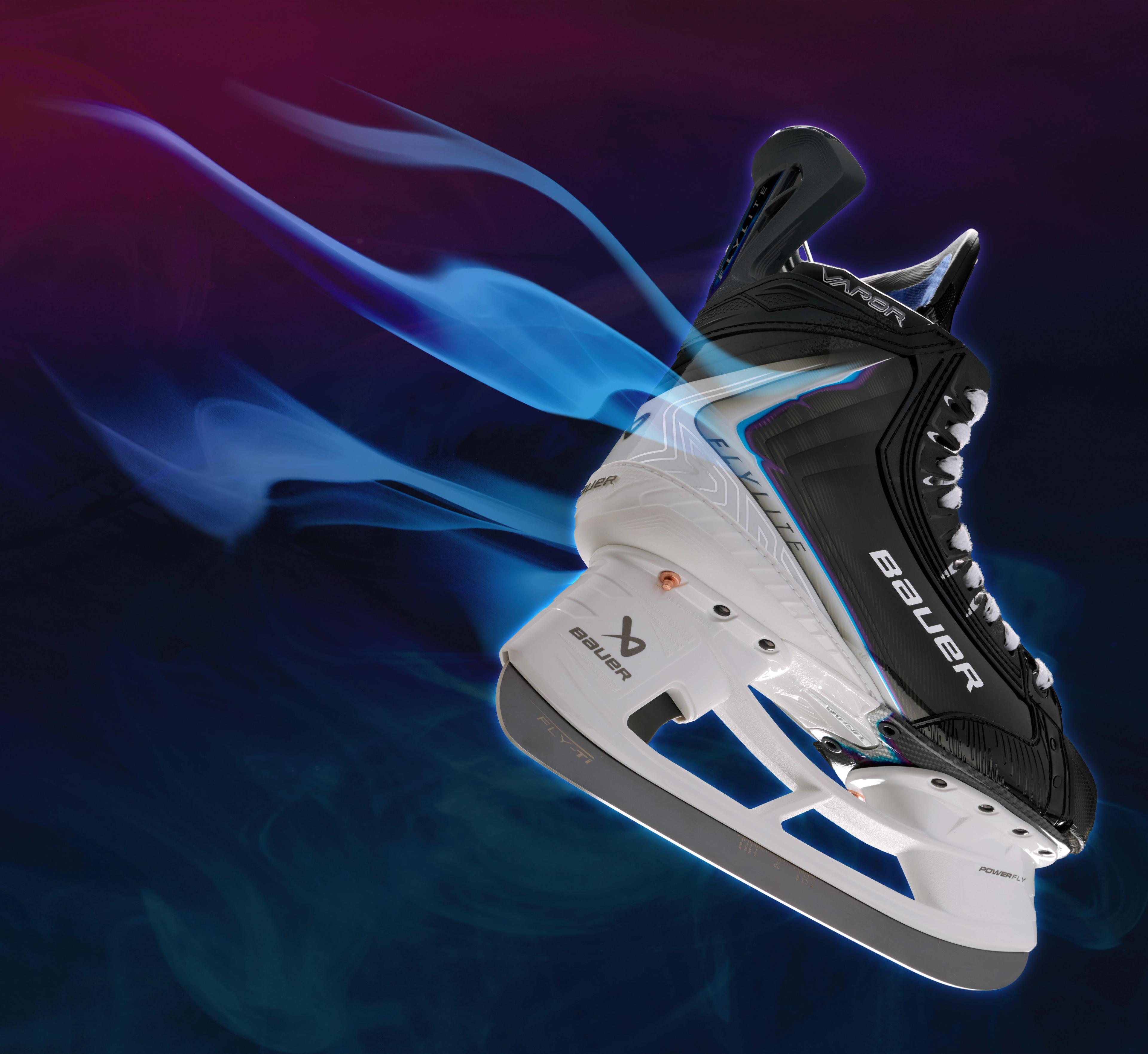 a pair of ice hockey skates are flying through the air .