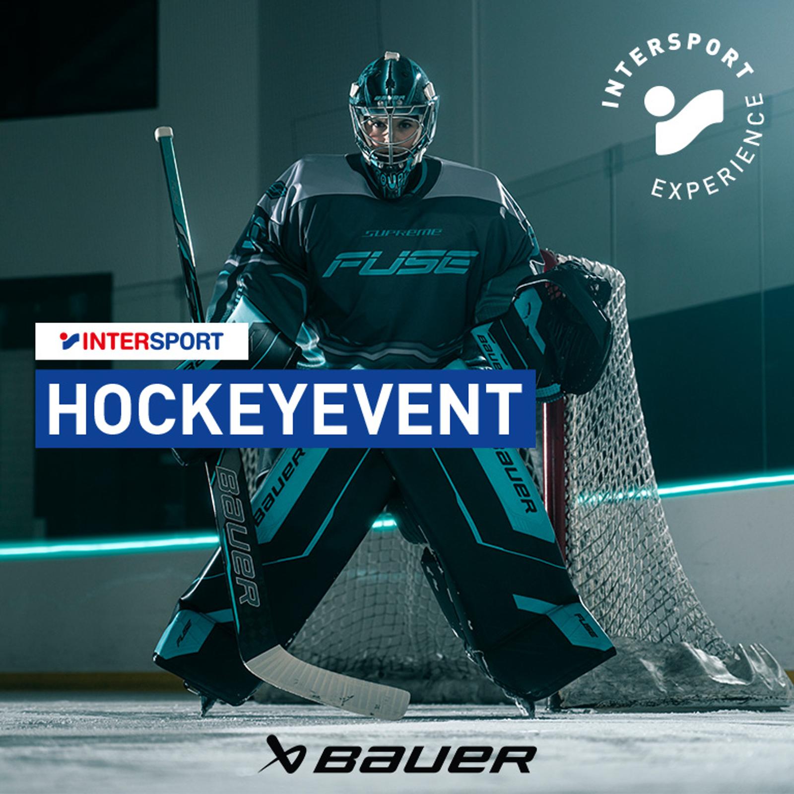 Hockey goalie in gear with "HOCKEYEVENT," "INTERSPORT," "Bauer," and "INTERSPORT EXPERIENCE" logos.