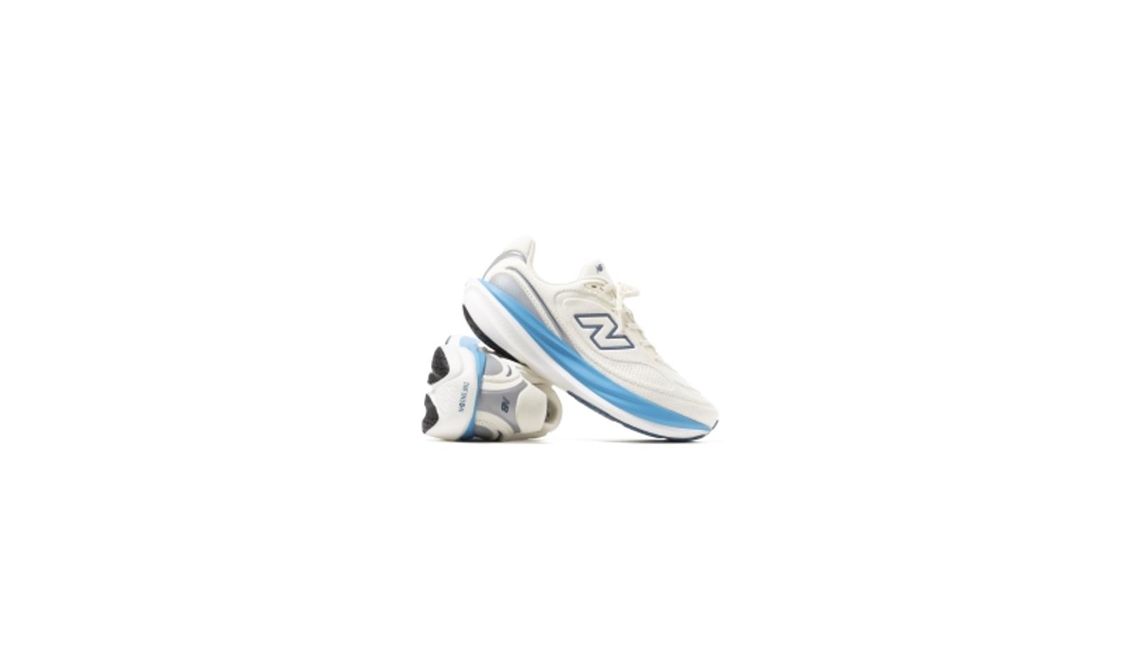 Pair of cream and light blue New Balance sneakers.