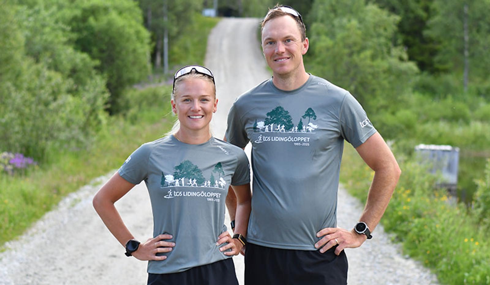 a man and a woman are standing next to each other on a dirt road .