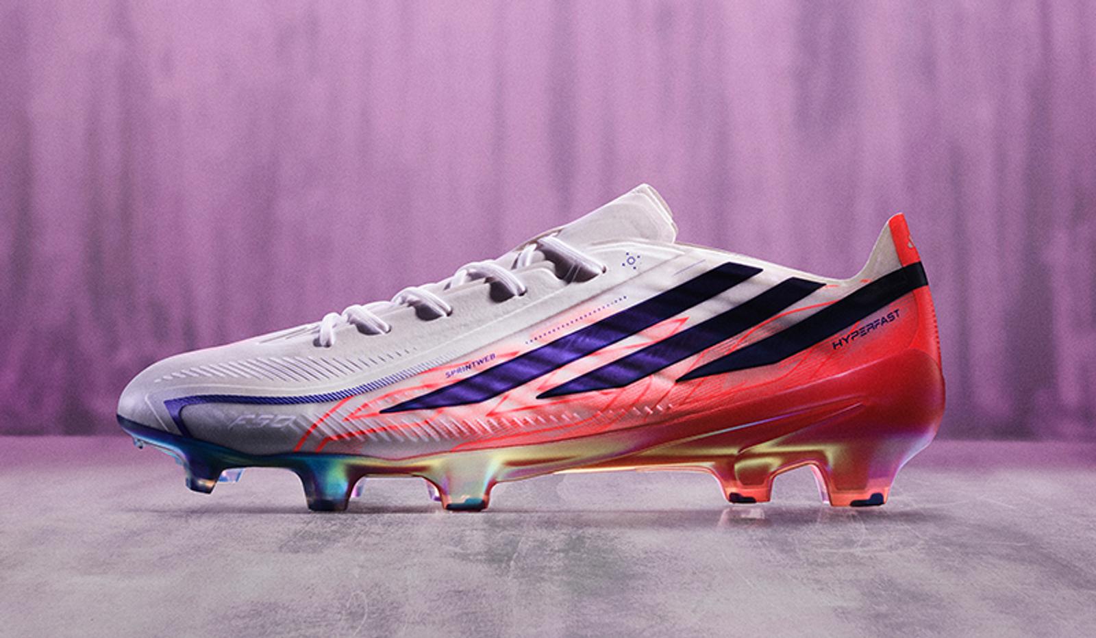 White athletic cleat with purple stripes and a rainbow iridescent sole.