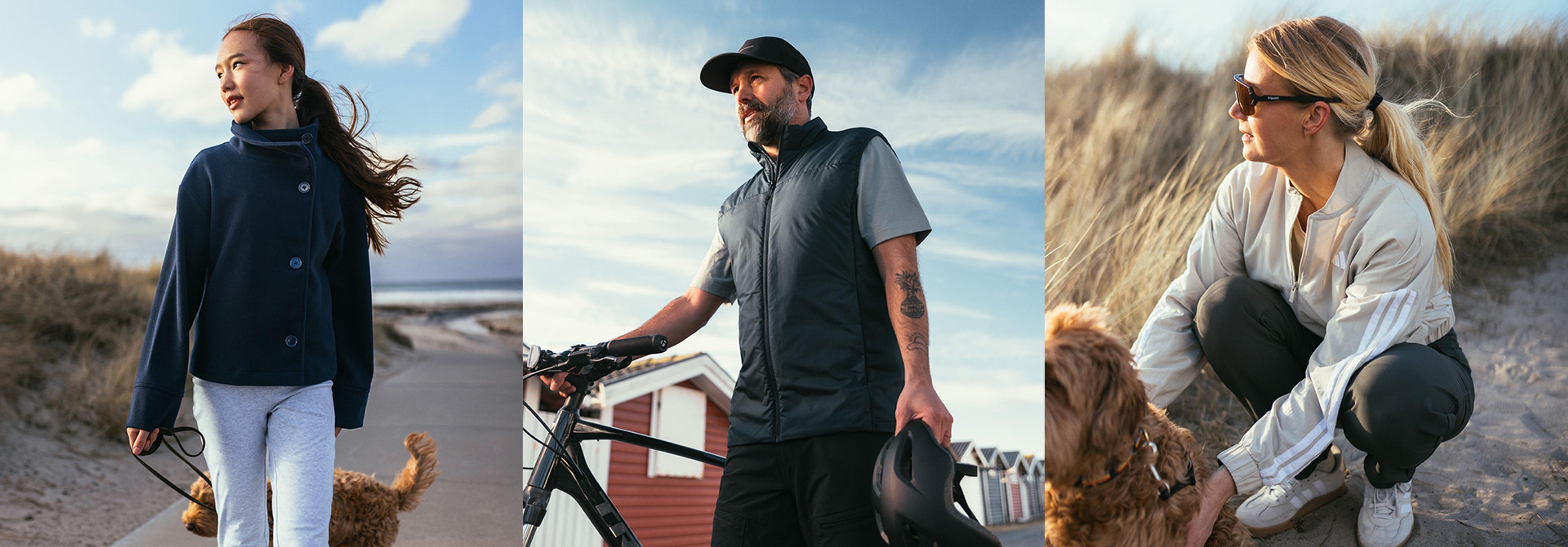 Three people engaged in outdoor activities by the coast; two with dogs, one with a bicycle.