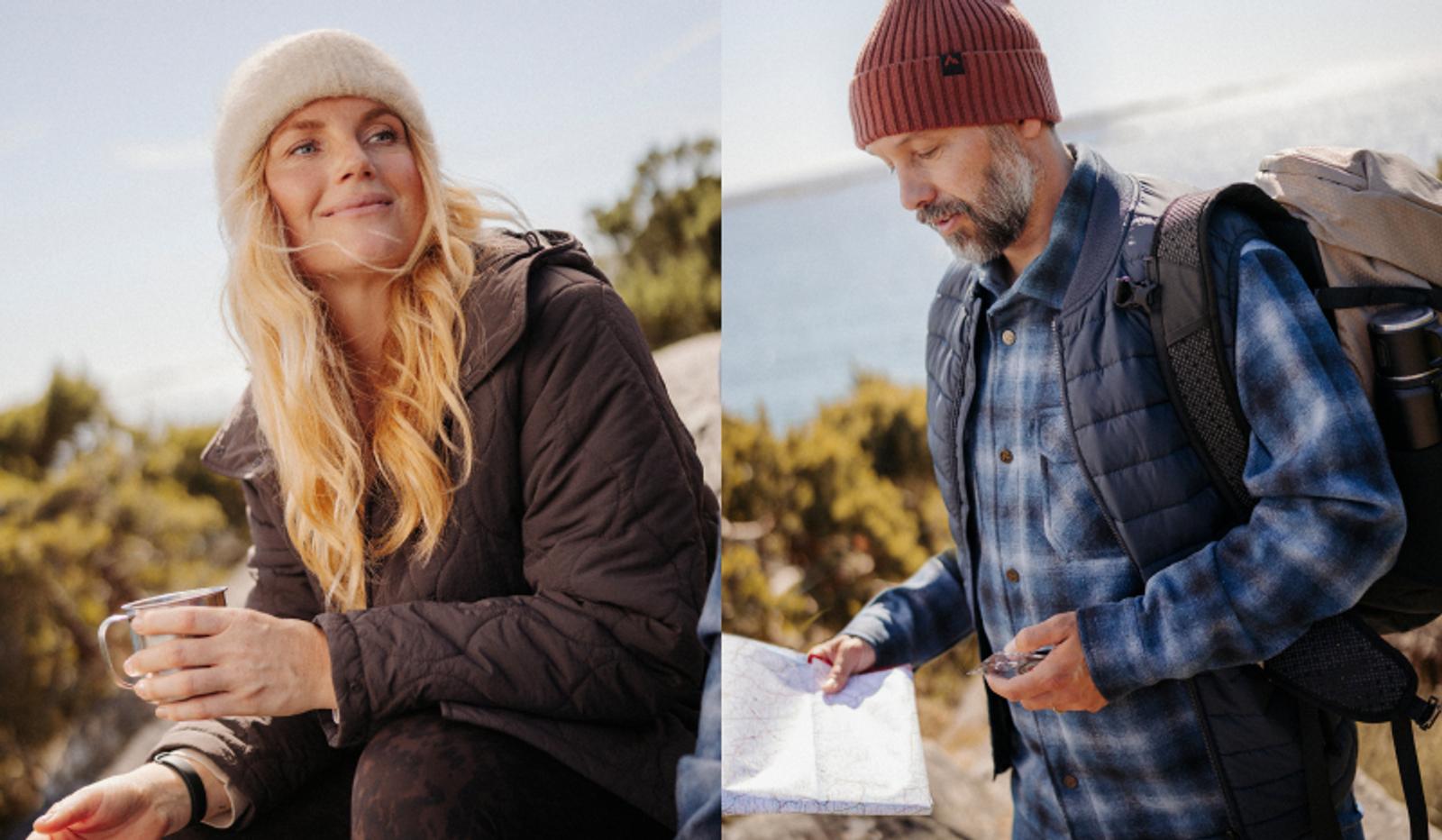 Two hikers outdoors: a woman in a beanie holds a mug, and a man checks a map and compass.