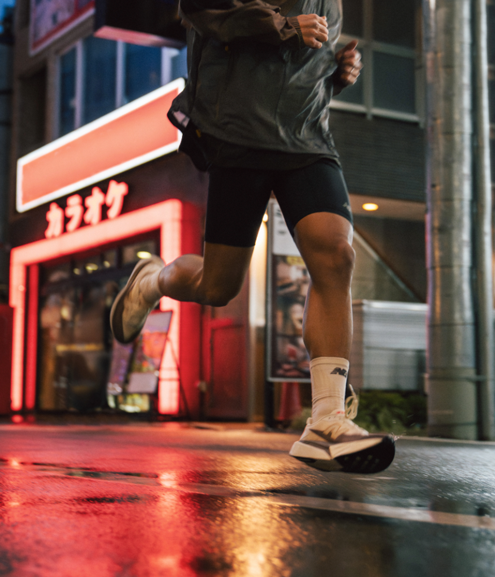 a person running in front of a building with chinese writing on it