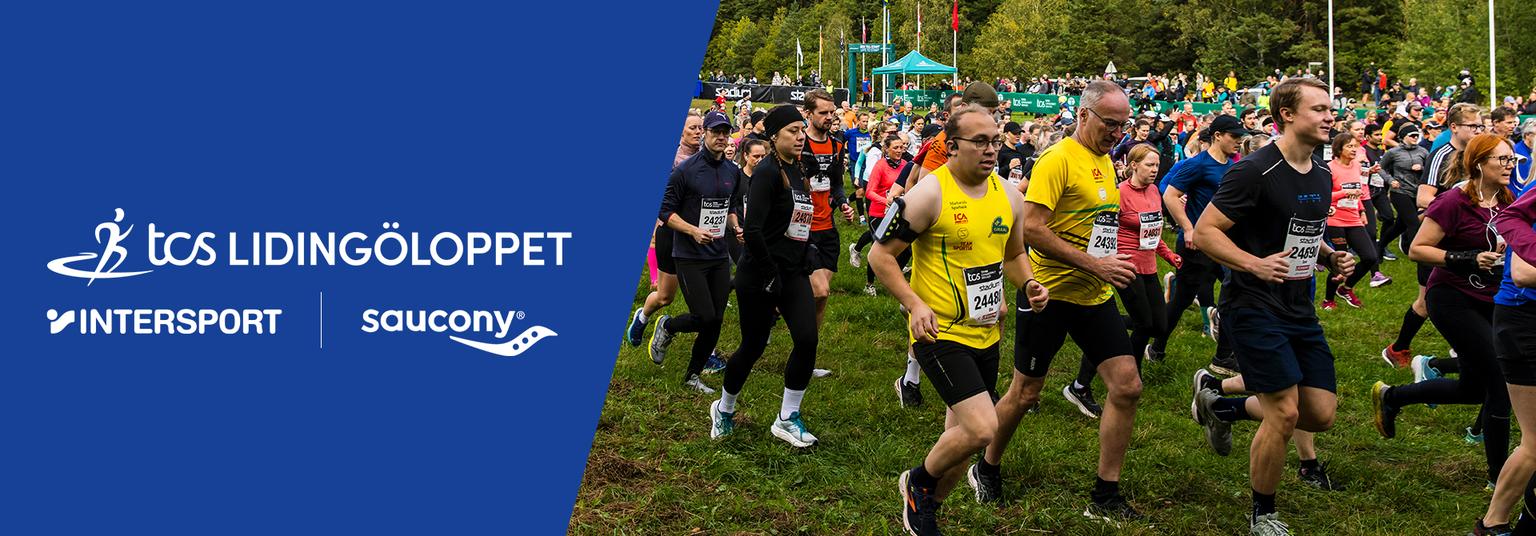 a group of people are running in a field .