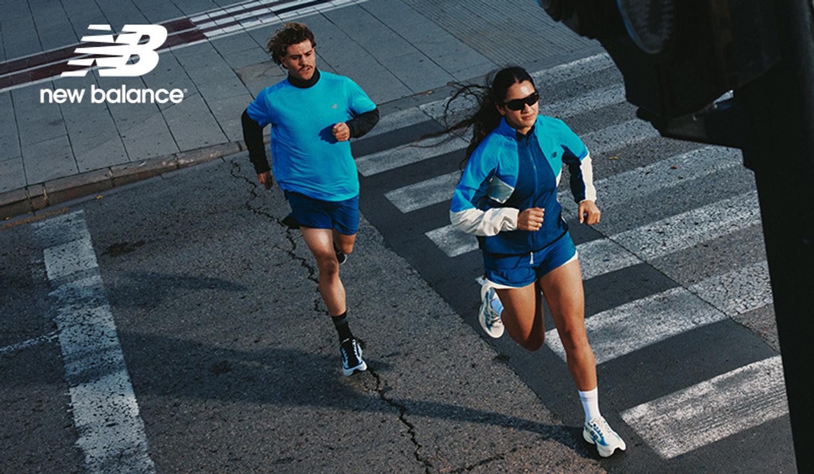 New Balance ad featuring a man and a woman running on a street crosswalk.