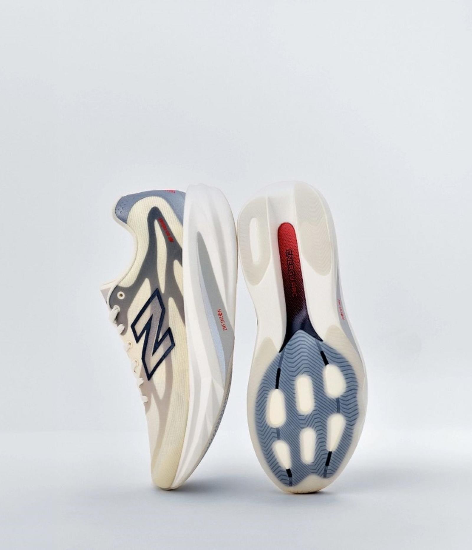 A pair of light New Balance running shoes on a white background, one showing its side and the other its sole.