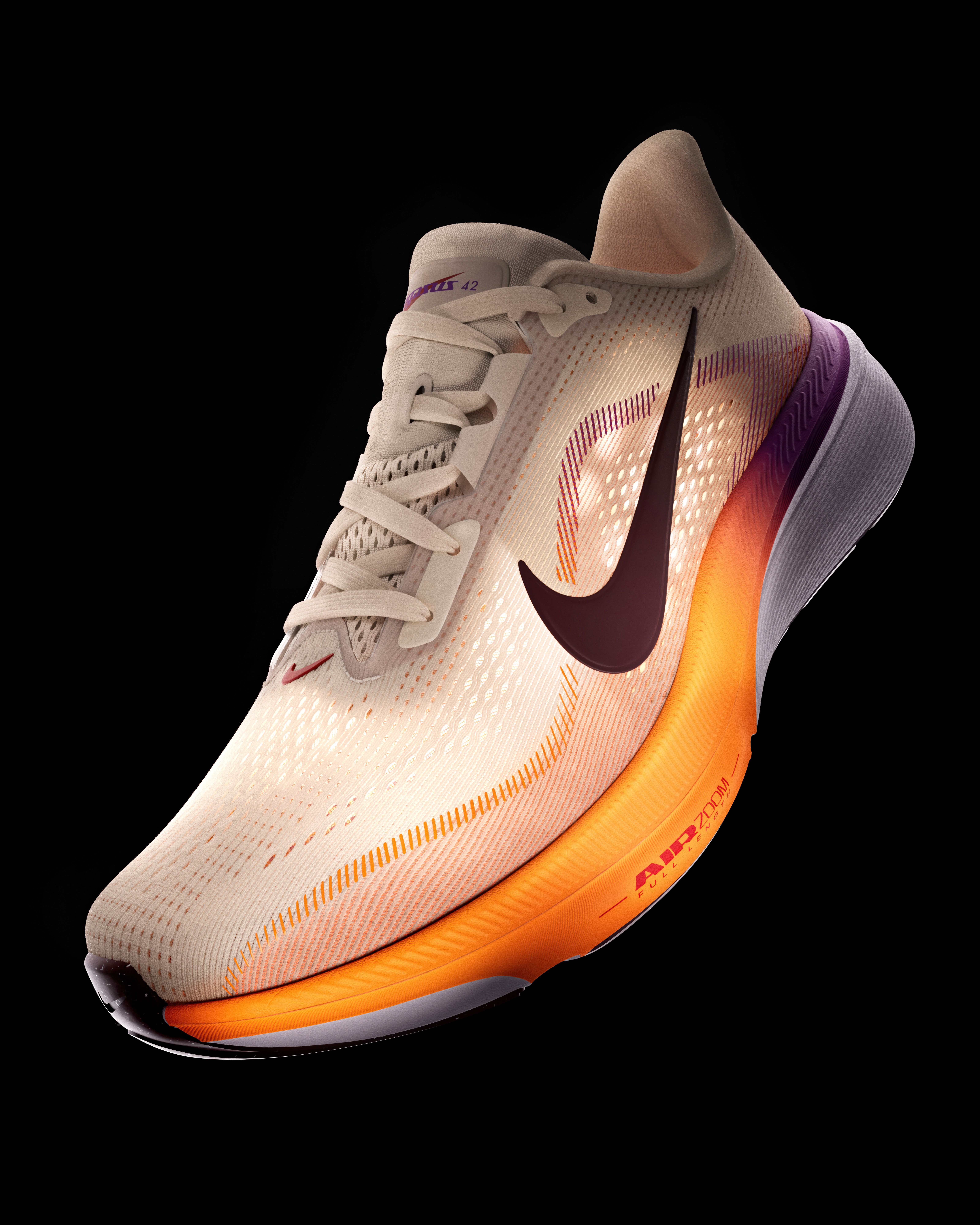 A light beige Nike running shoe with a dark maroon swoosh and an orange-purple gradient midsole on a black background.