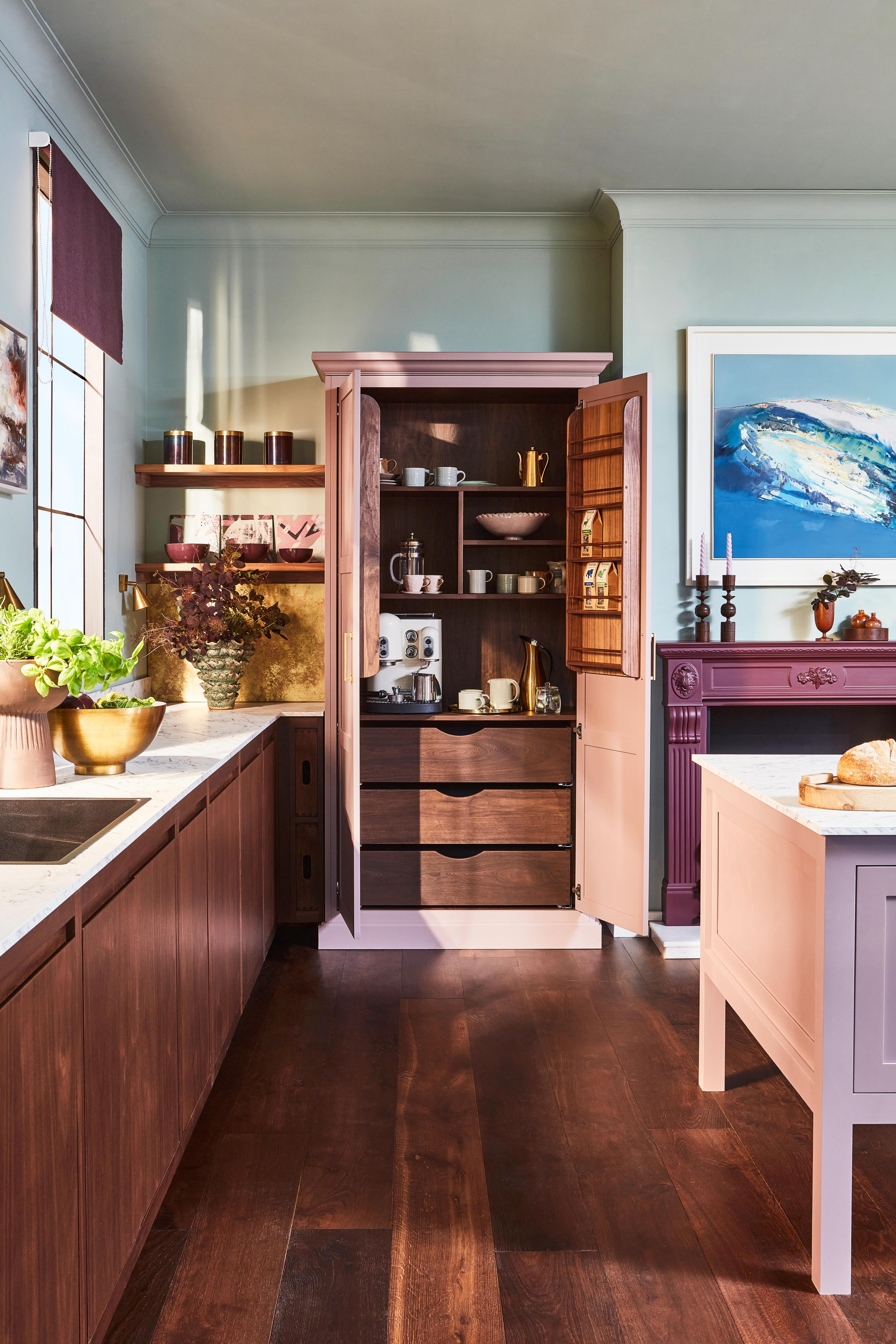 Open pantry cabinet with an internal countertop holding a coffee machine and kettle, timber shelving, deep drawers and racks in the door — the Houghton kitchen by Naked Kitchens