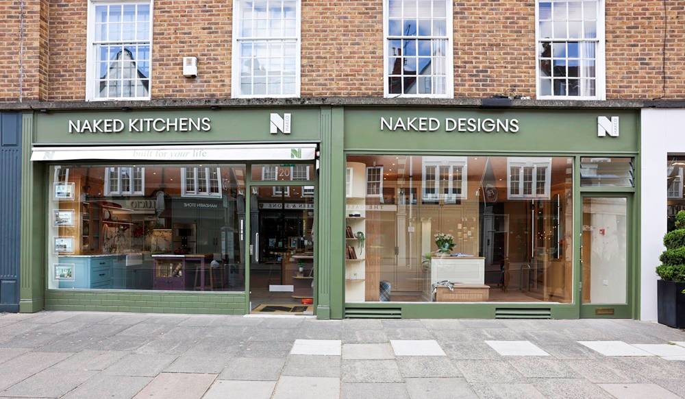 Naked Kitchens Chelsea Showroom storefront, green shopfront with a canopy "built for your life"