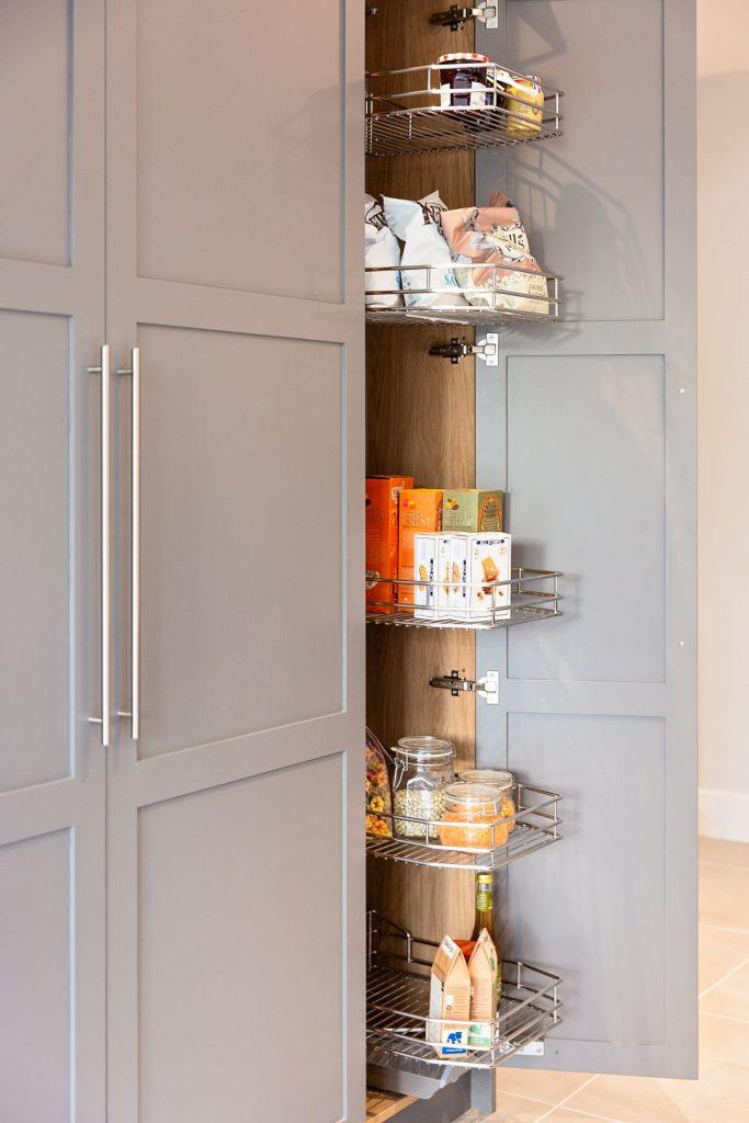 A photograph of our articulated corner cabinet shelving, perfect for U-shaped kitchens