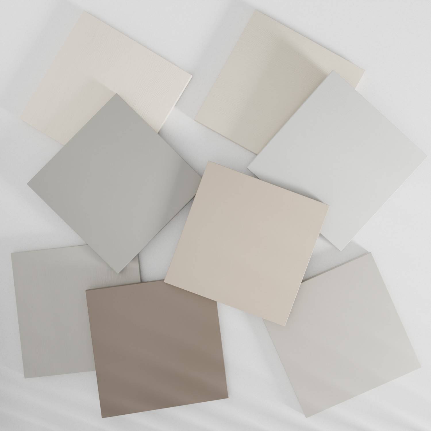 Eight square tiles in various shades of beige and cream are arranged in a slightly overlapping pattern on a light background. The tiles have subtle color and texture variations.