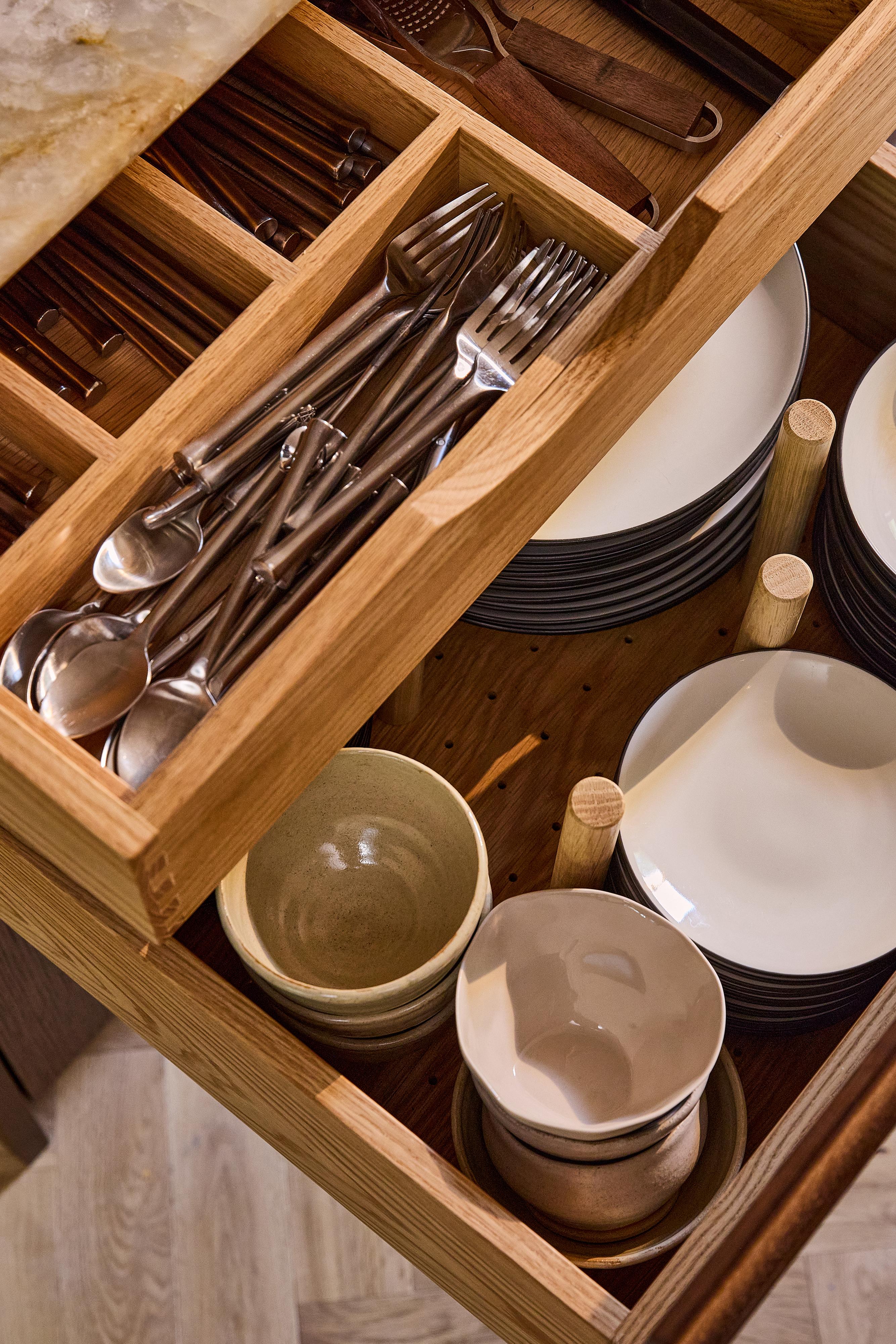 A close-up of a Internal Drawers in walnut finish.