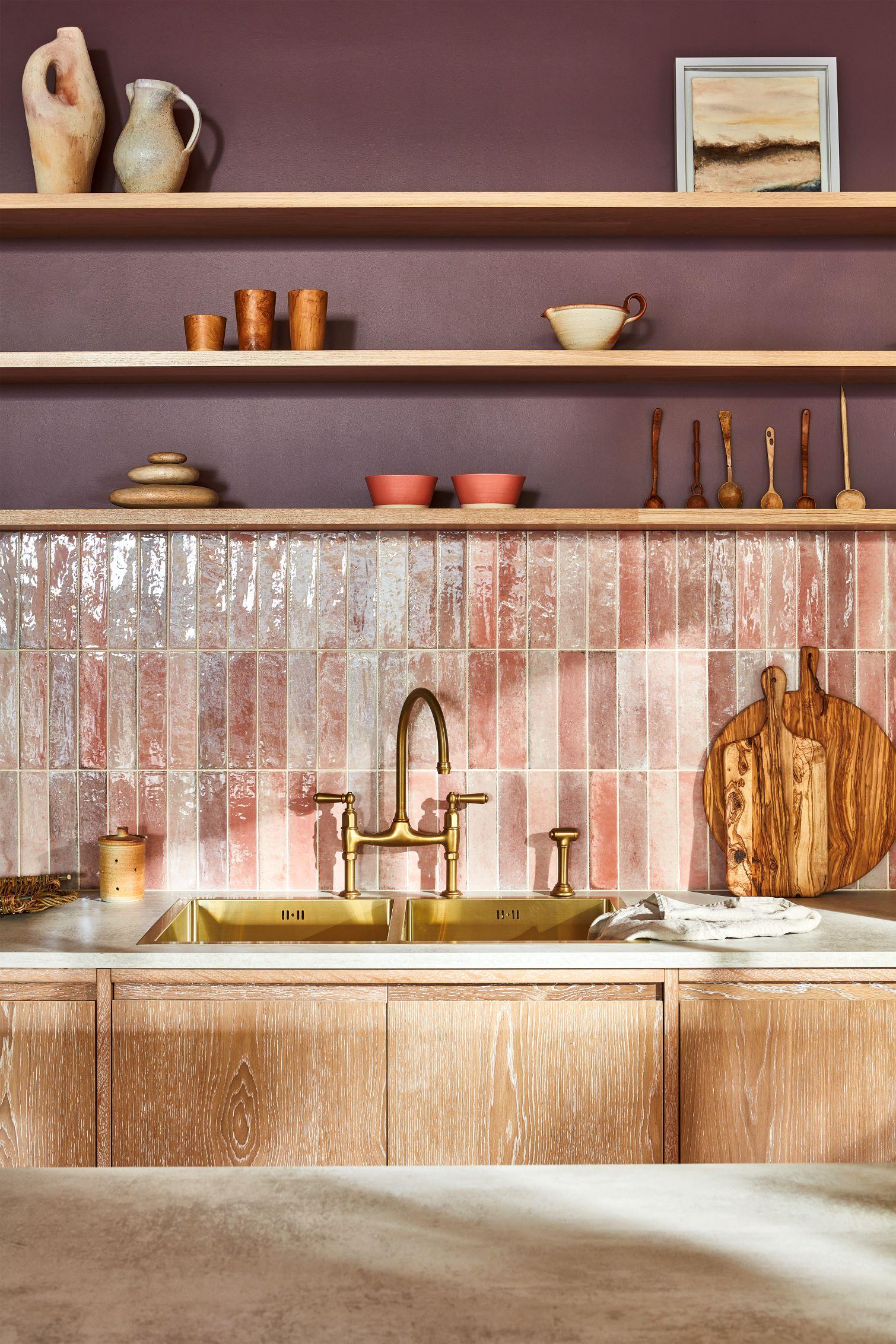 A close-up of the kitchen's brass double sink, a testament to exquisite craftsmanship and luxurious details. The sink's intricate design and gleaming finish elevate the overall kitchen aesthetic, adding a touch of sophistication.