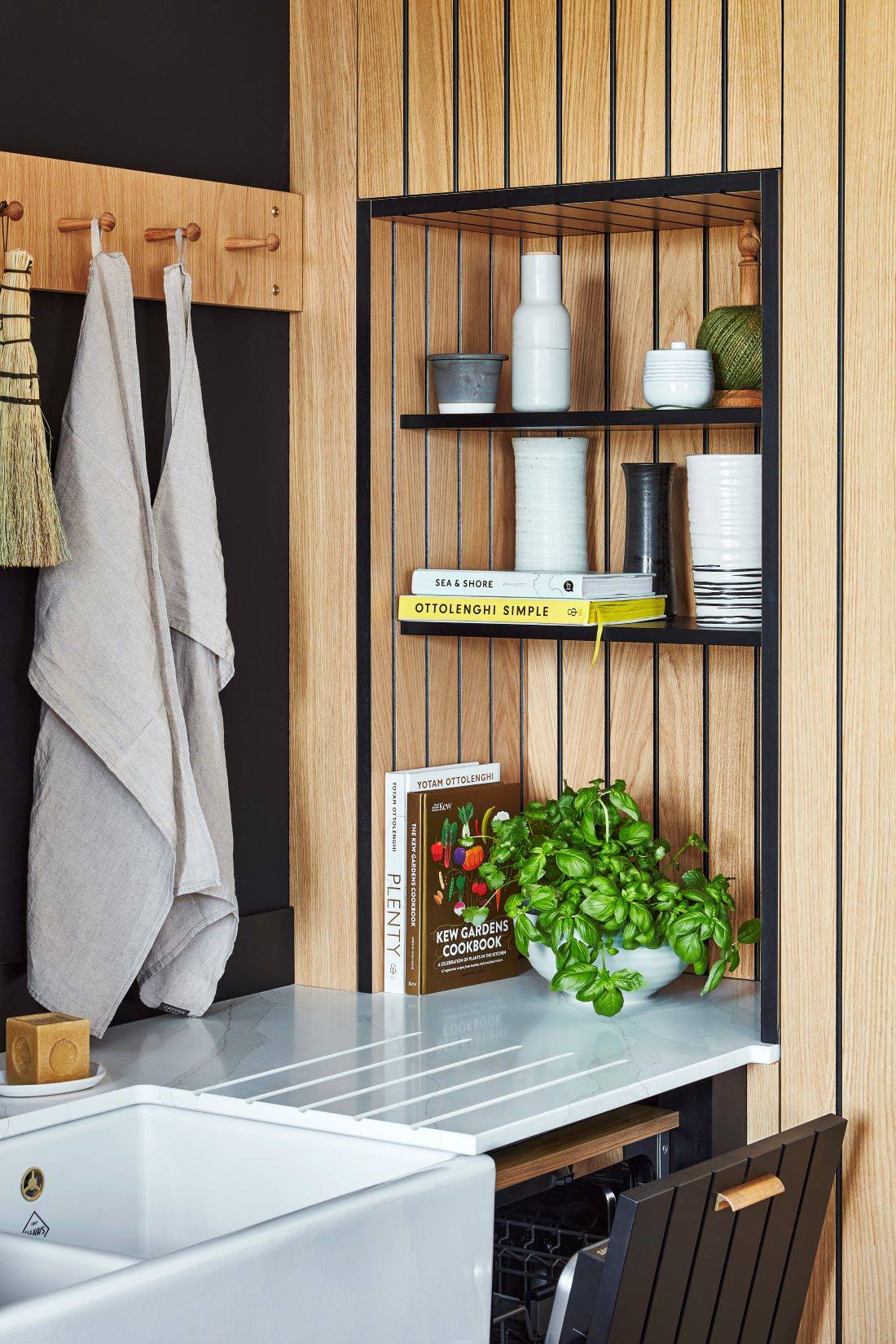Close-up of the Kitchen's oak shaker peg rails, adding a functional and decorative element to the space, perfect for hanging utensils or towels.