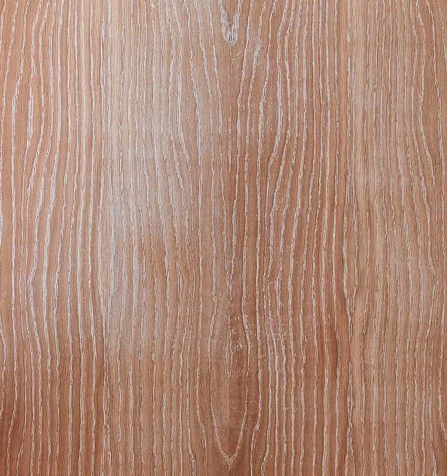 Close-up of a wooden surface with a light brown hue. The wood grain pattern runs vertically, featuring wavy lines and natural textures, creating an organic and rustic appearance.