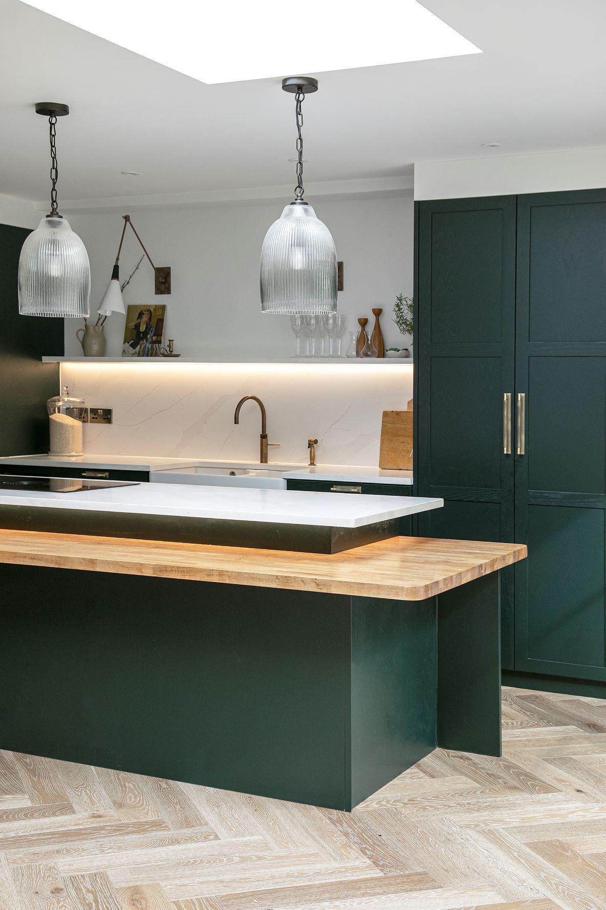 A warm and inviting Westward Ho kitchen with exposed Sandringham Pine fronts, exuding an effortless chic aesthetic that invites creativity and culinary adventures.
