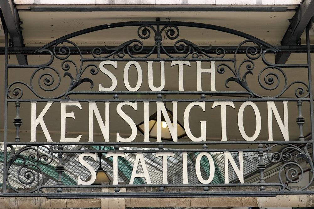 Traditional metal sign saying South Kensington Station