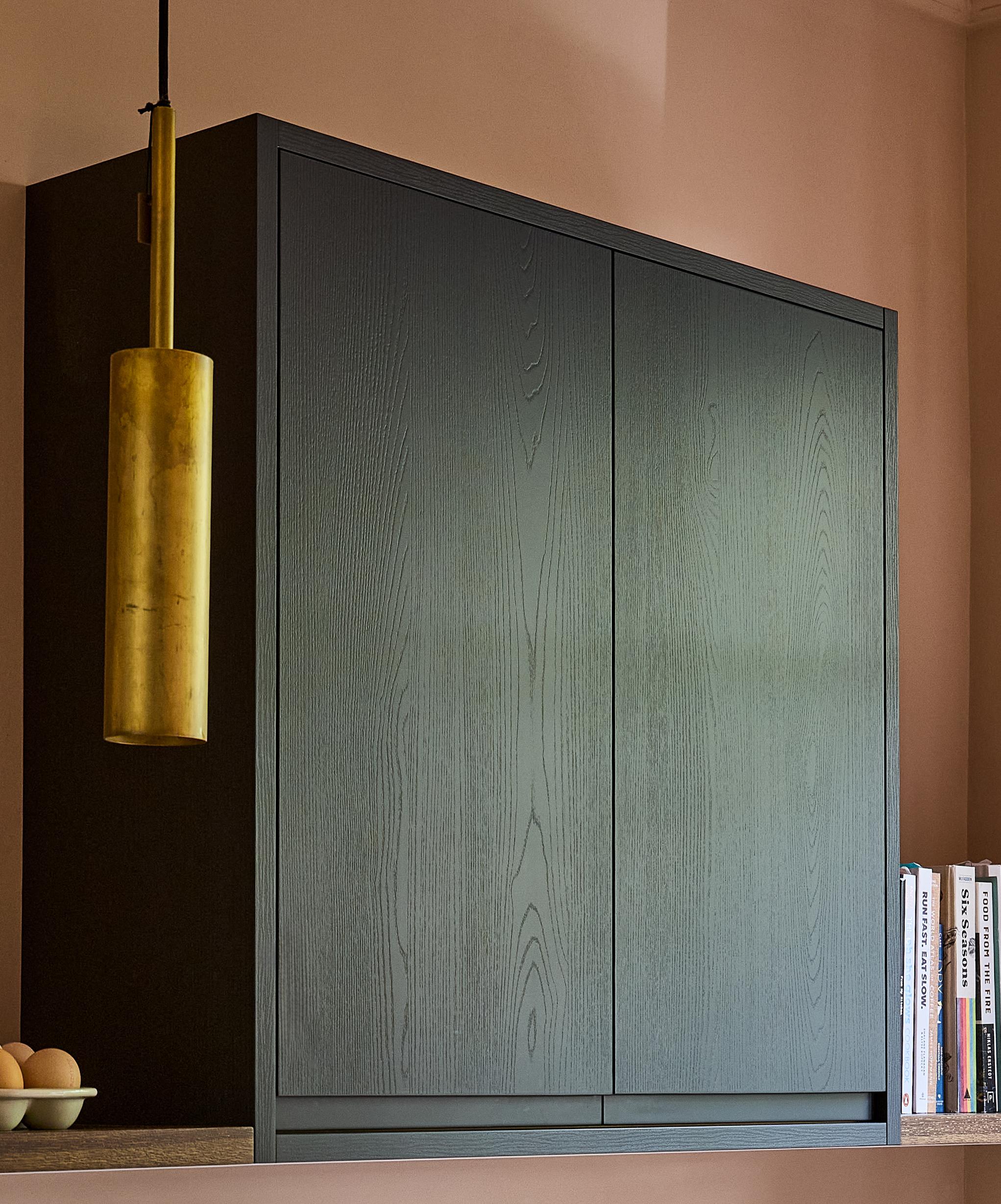 Close-up of a j-groove door in dark finish.