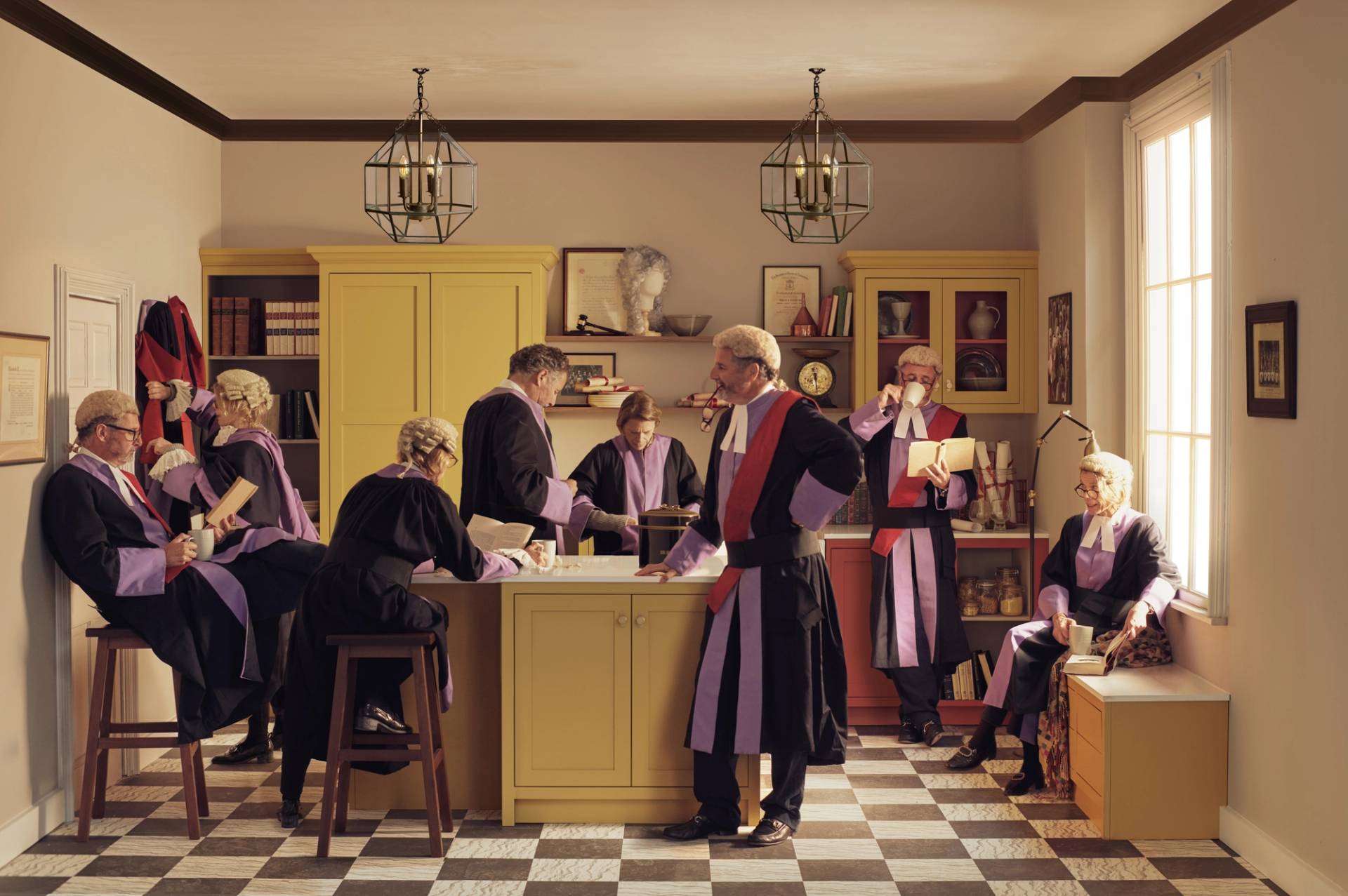Group of legal professionals in traditional judicial robes and wigs socialising in a contemporary yellow and red kitchen. A conceptual take on "judging" kitchen quality, featuring a checkered floor and minimalist cabinetry.