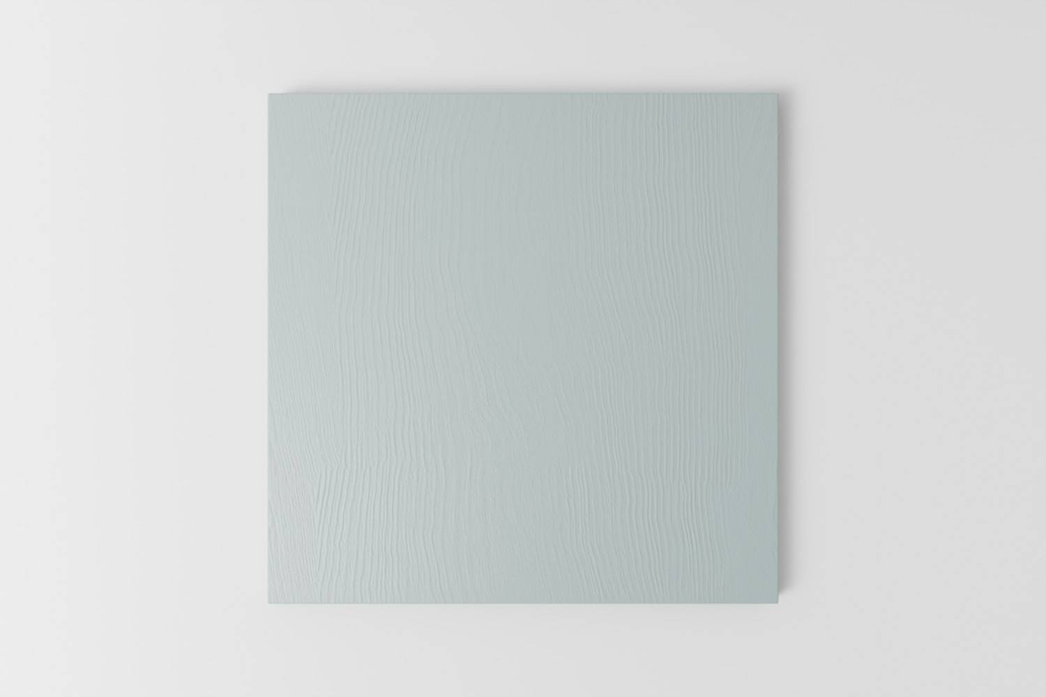 Picture of a square sample painted with a visible grain in Naked Kitchen's First Flight blue colour