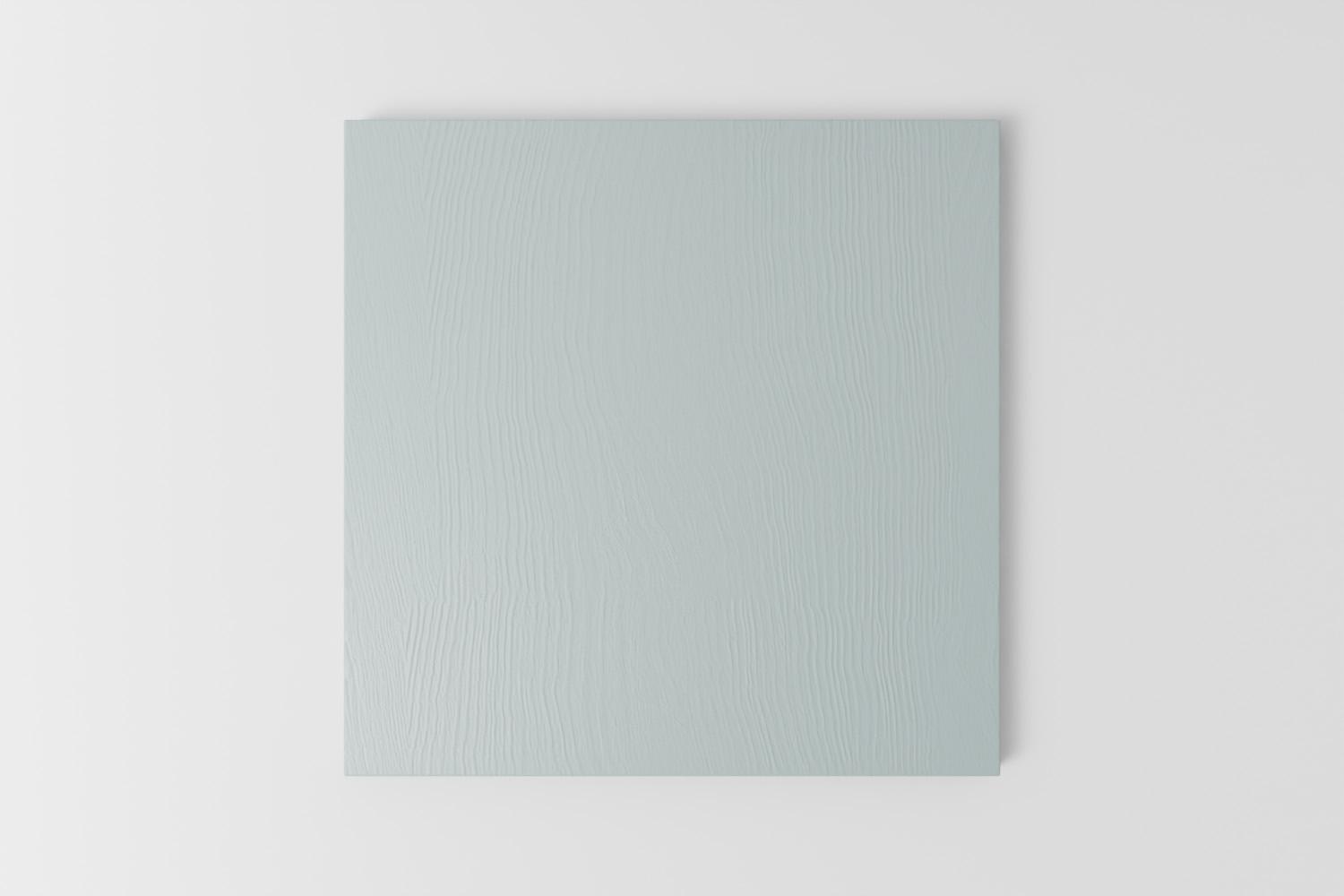 Picture of a square sample painted with a visible grain in Naked Kitchen's First Flight blue colour