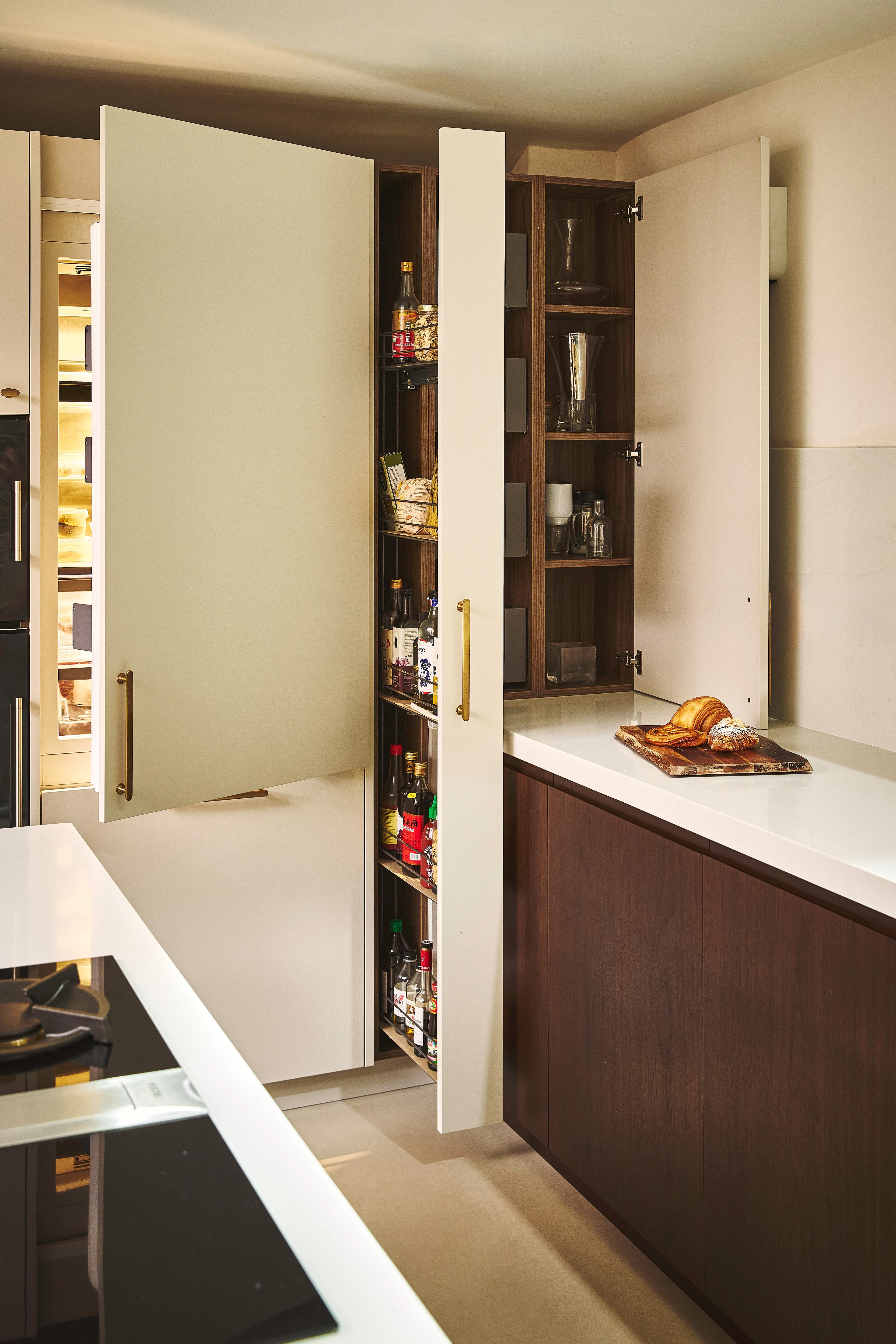Modern kitchen with open fridge.