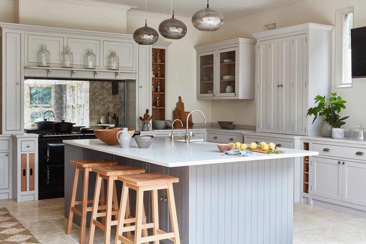 large kitchen island with overhang for breakfast bar plus taps and quartz worktop