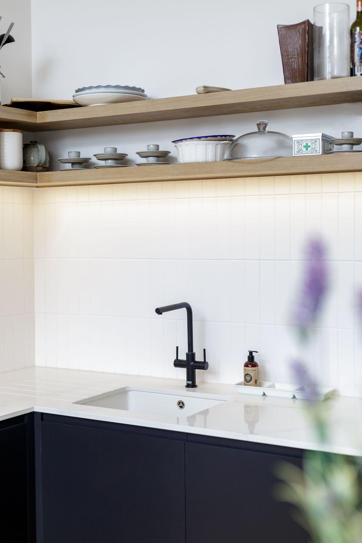 Close-up of the kitchen's open shelving, showcasing the storage capacity and decorative charm. Glassware and decorative accents add a touch of personality, while the ample space ensures organisation and accessibility.