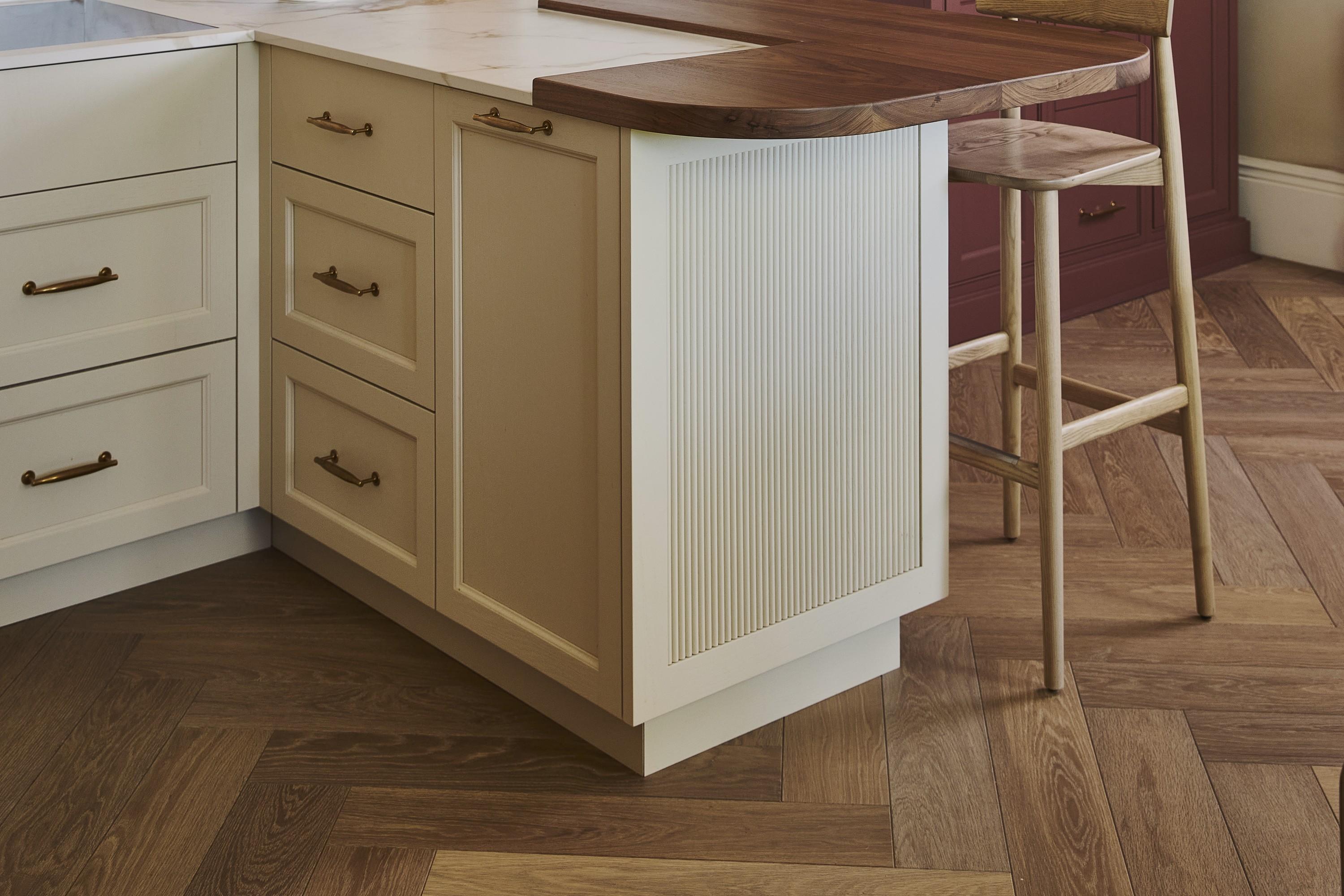 Old Chelsea kitchen by Naked Kitchens, with bespoke cabinetry over a herringbone oak floor by Waxed Floors