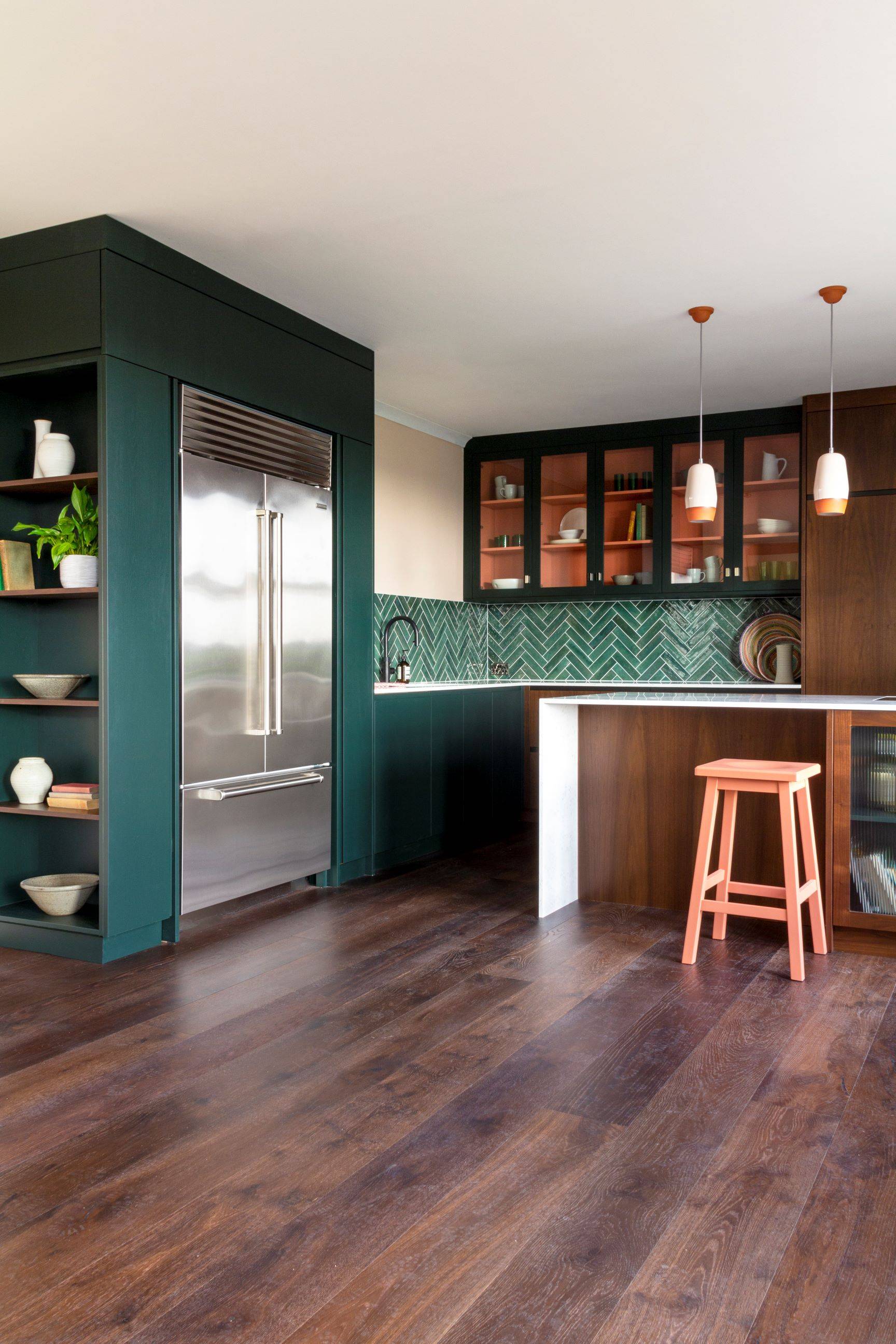 A warm and inviting Blenheim kitchen with exposed walnut fronts, exuding an effortless chic aesthetic that invites creativity and culinary adventures.