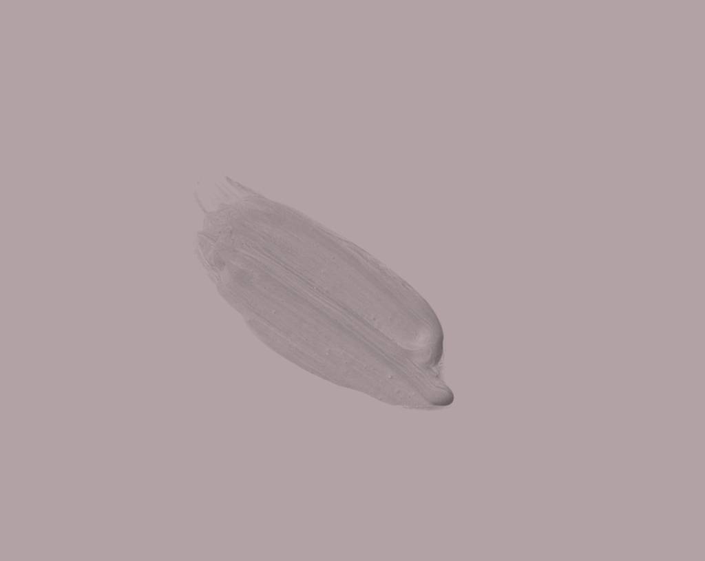 A single brushstroke of light purple paint on a pale lavender background.