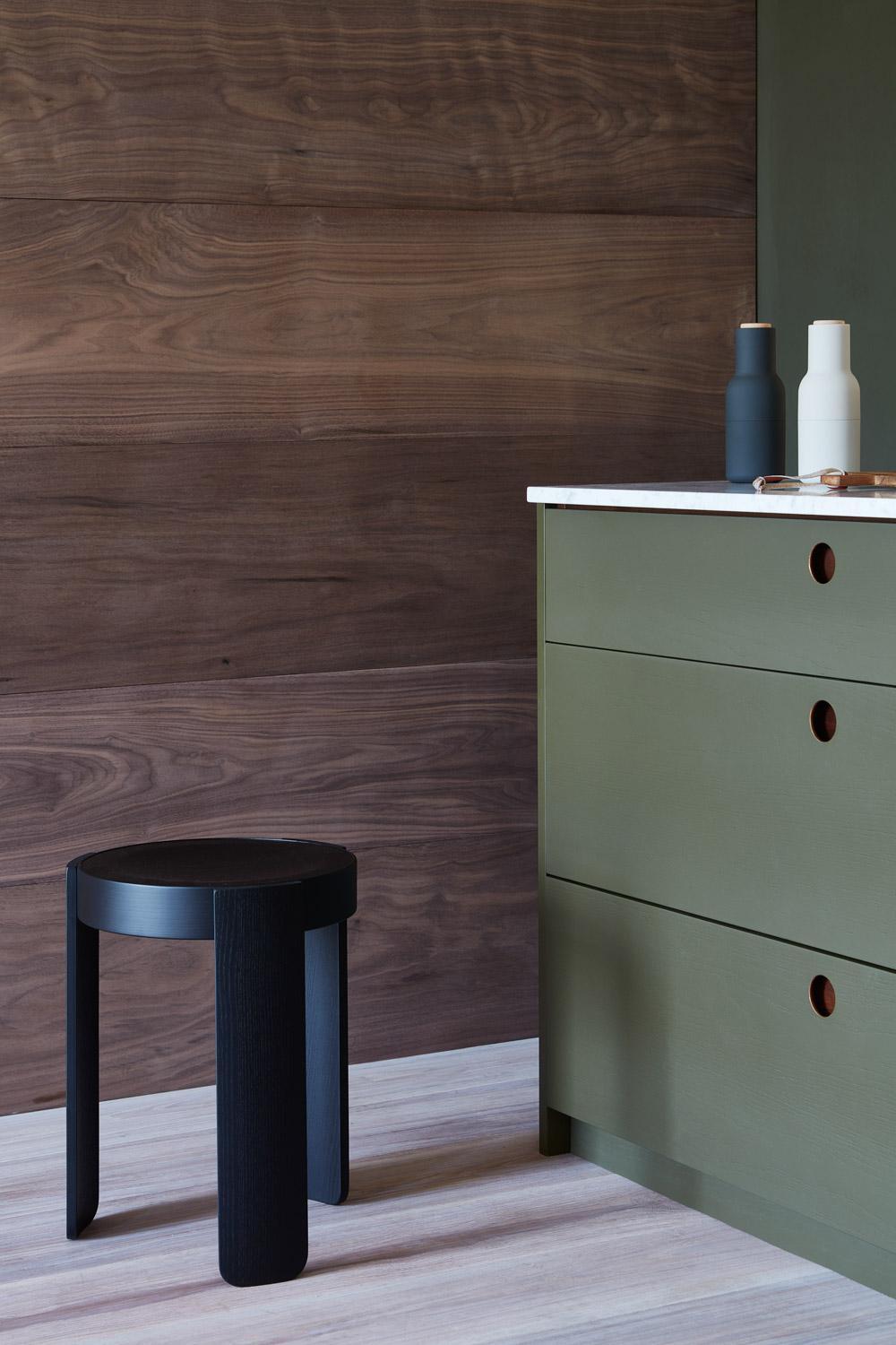 The Ladbroke kitchen seamlessly blends into a contemporary living space, showcasing its versatility and adaptability. The kitchen's modern aesthetic is complemented by the sleek countertops and appliances, creating a sophisticated and inviting ambiance