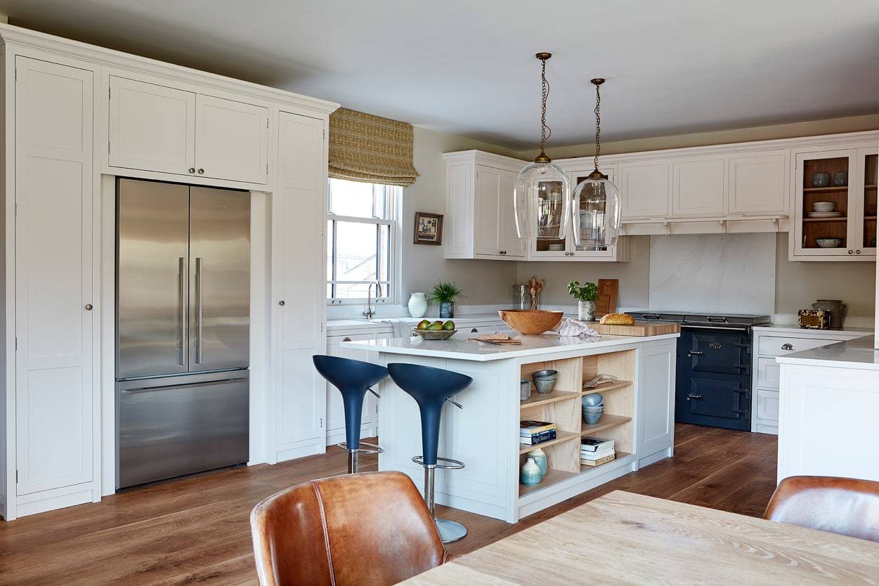 white shaker kitchen with island and blue aga