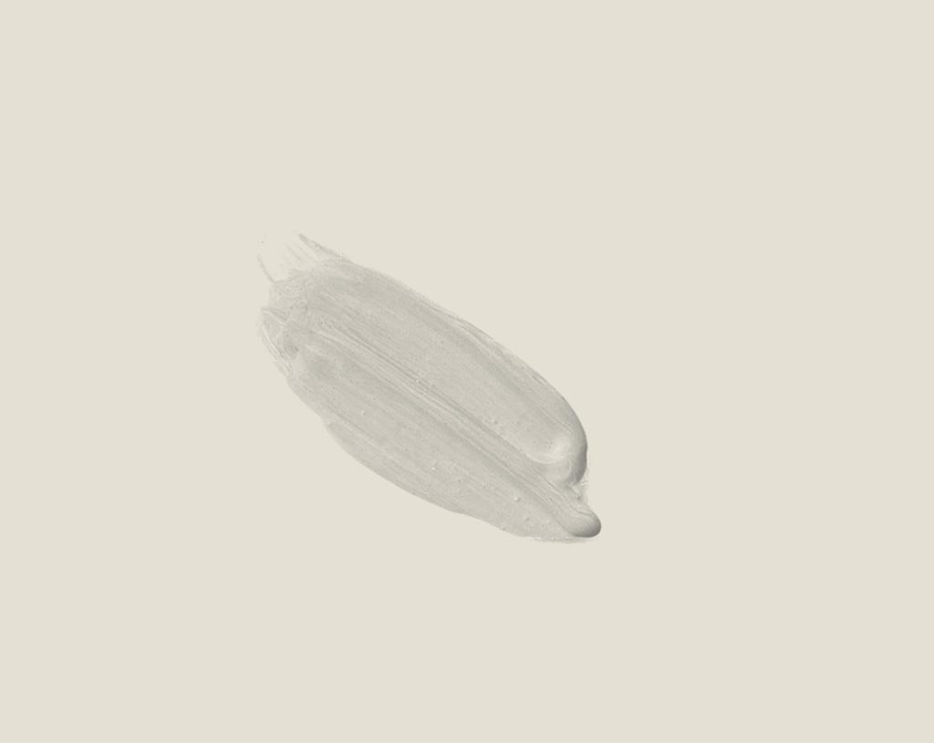 A blob of Seal Pup White paint on a background of the same color