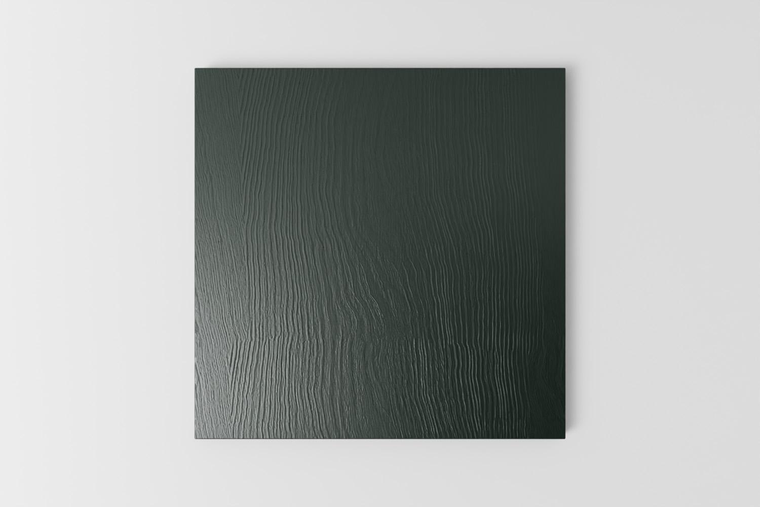 Picture of a square sample painted with a visible grain in Naked Kitchen's Sandringham Pine dark green colour