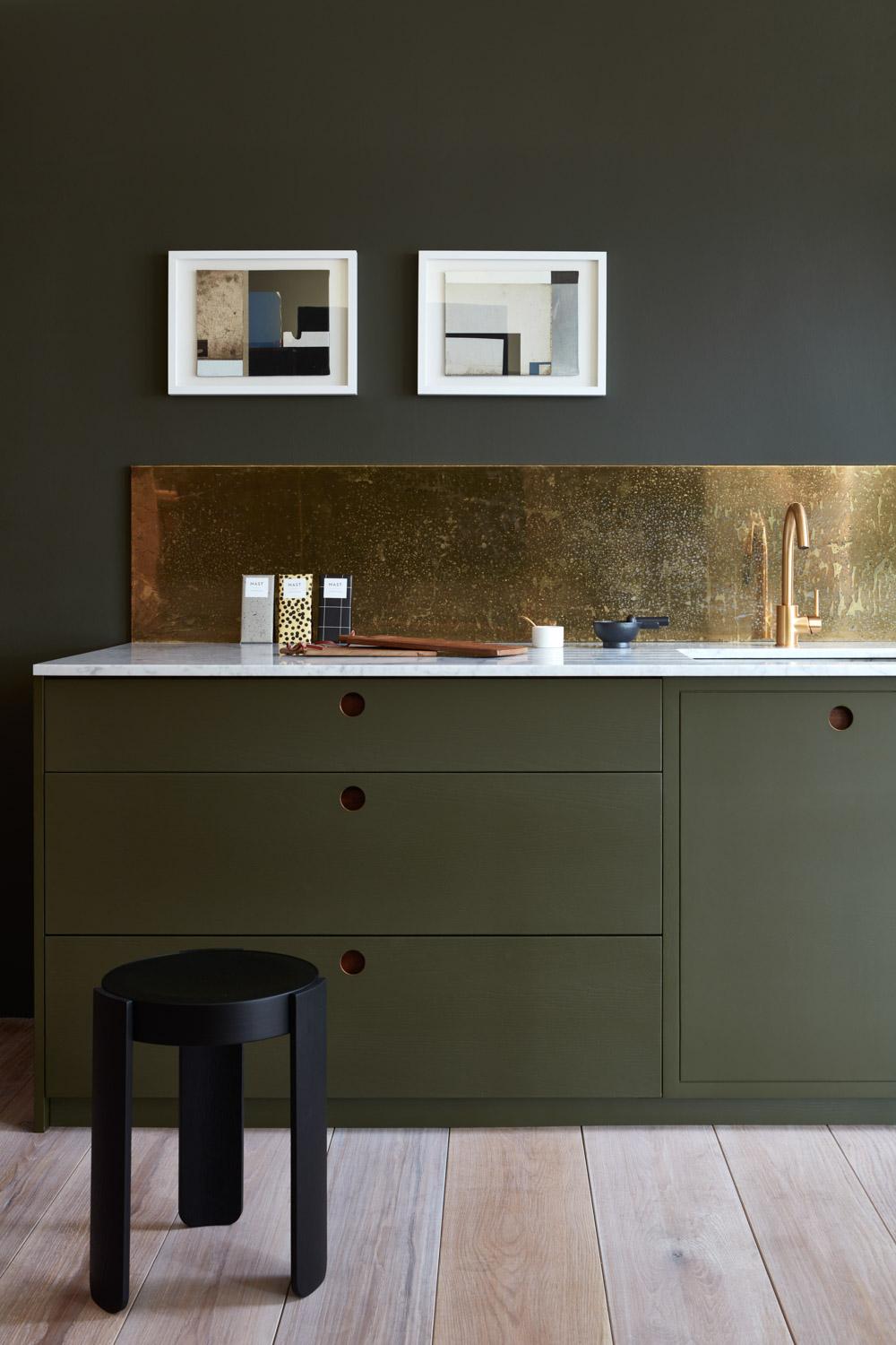 The Ladbroke kitchen seamlessly blends into a contemporary living space, showcasing its versatility and adaptability. The kitchen's modern aesthetic is complemented by the sleek countertops and appliances, creating a sophisticated and inviting ambiance