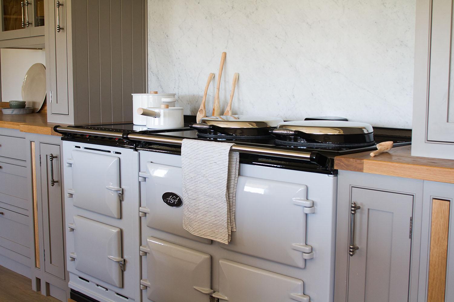 Integrated oven and cooker maintain clean lines while ensuring functionality, keeping the focus on the rustic aesthetics.