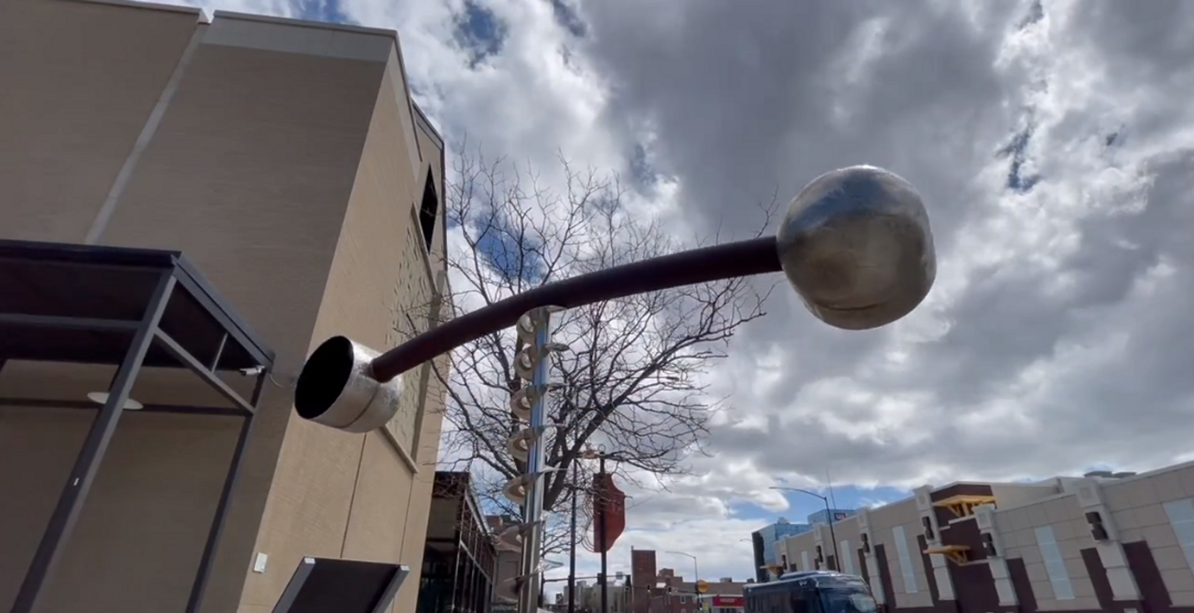 Gary Bates' sculpture Will-He-Drill turns in front of the Yellowstone Art Museum
