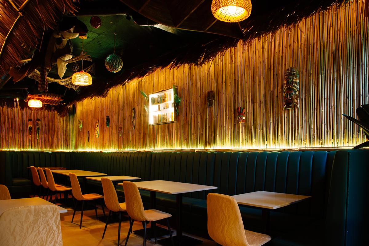 Tropical booth seating inside Jungle Bird