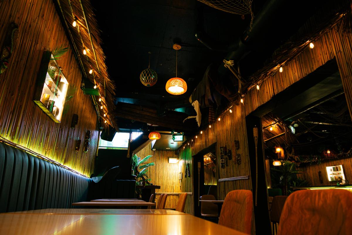 Immersive tropical interior design at Jungle Bird Tiki Lounge in Calgary