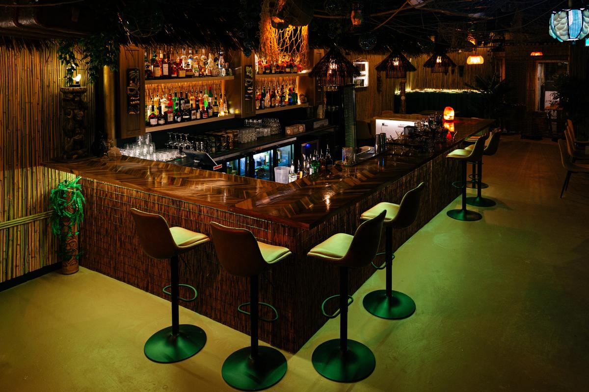 Evening ambiance along the tiki bar counter