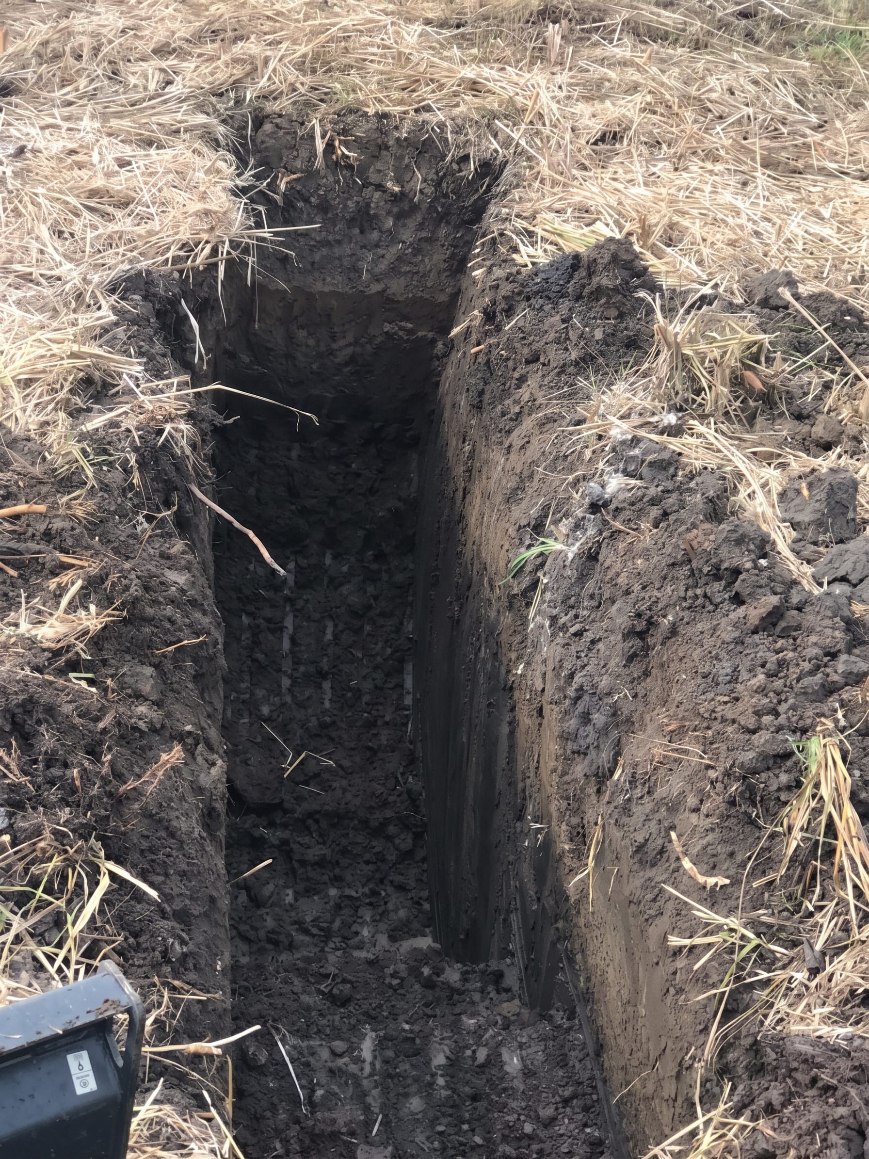 A deep, clean-walled trench
