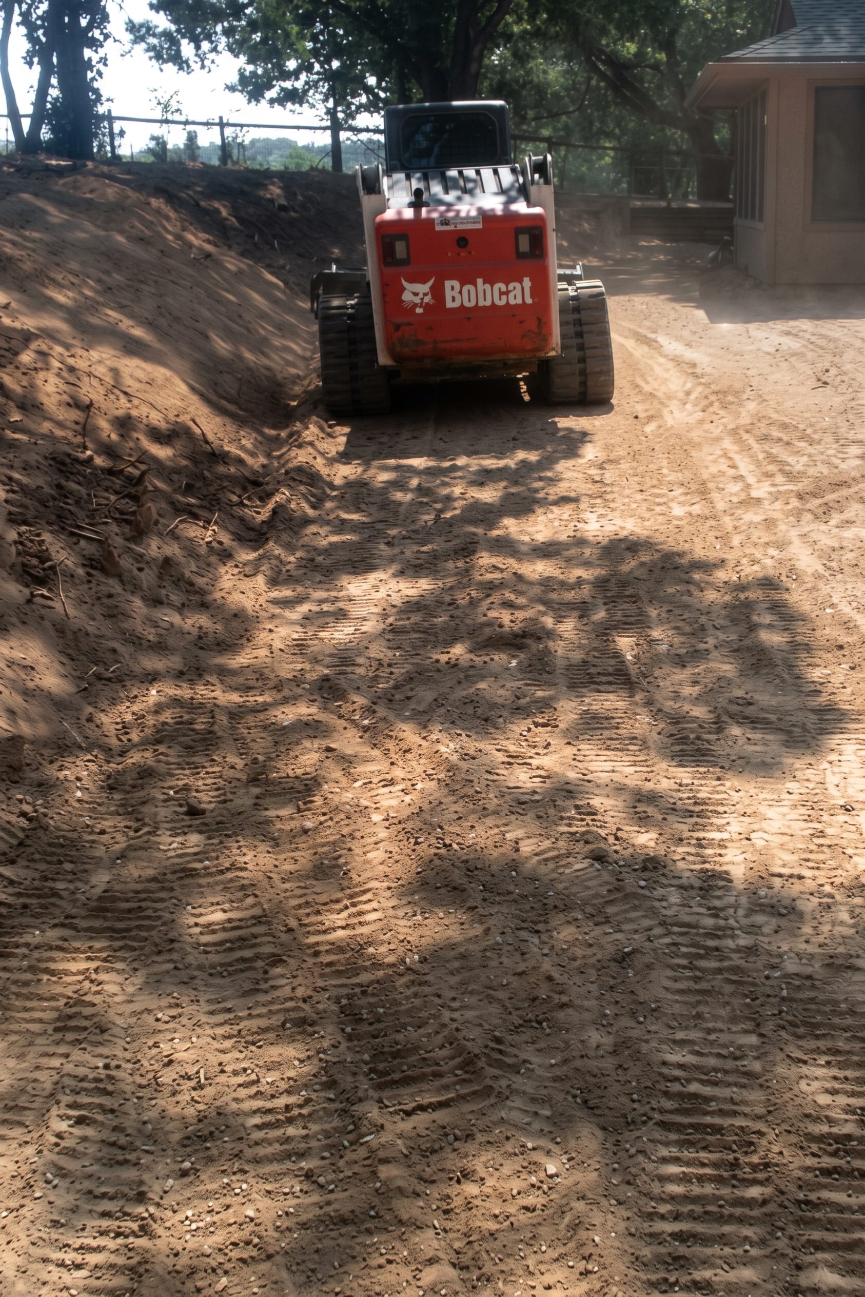 Grading a drive with the track loader